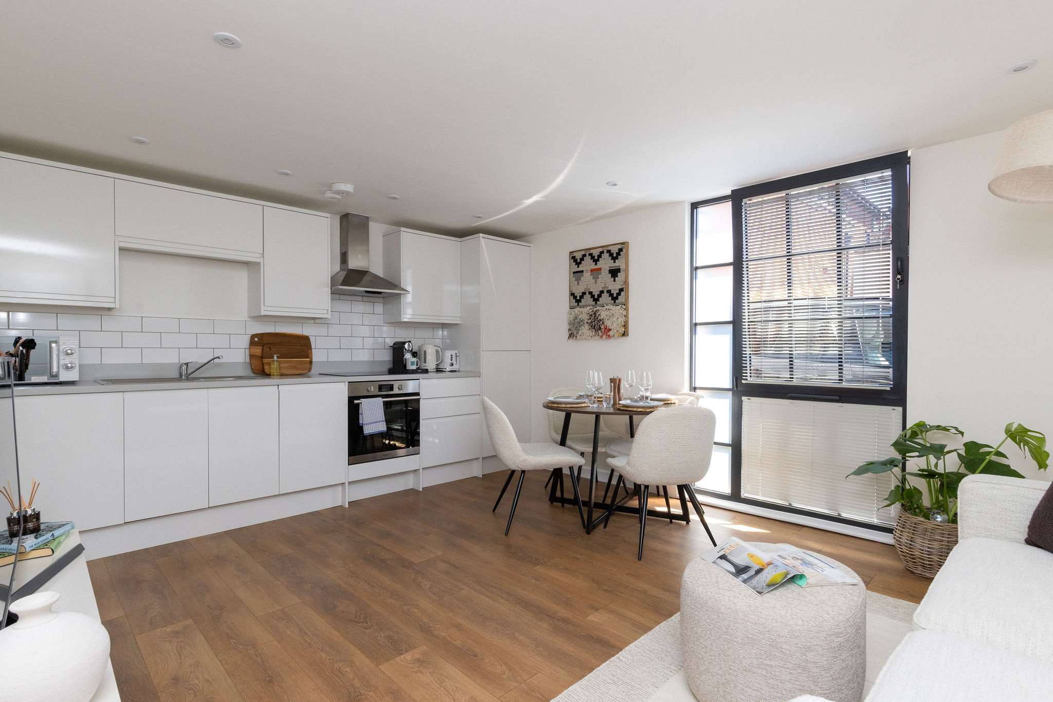 Bright open-plan living space with modern kitchen, perfect for stylish self-catering city breaks.