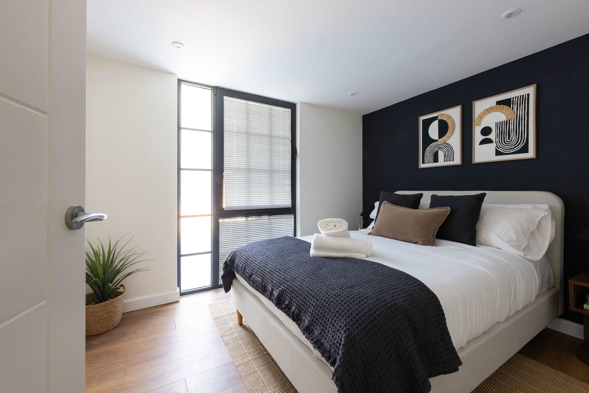 Modern double bedroom offering a peaceful retreat after exploring Chichester and the nearby coast.