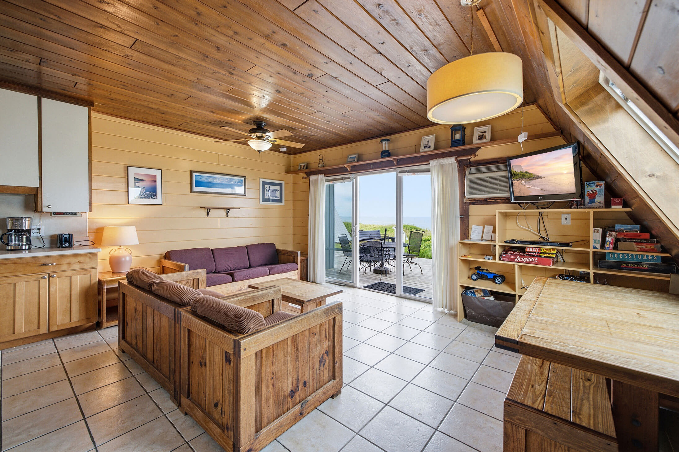 Open living area flows seamlessly to the lakefront deck and views.