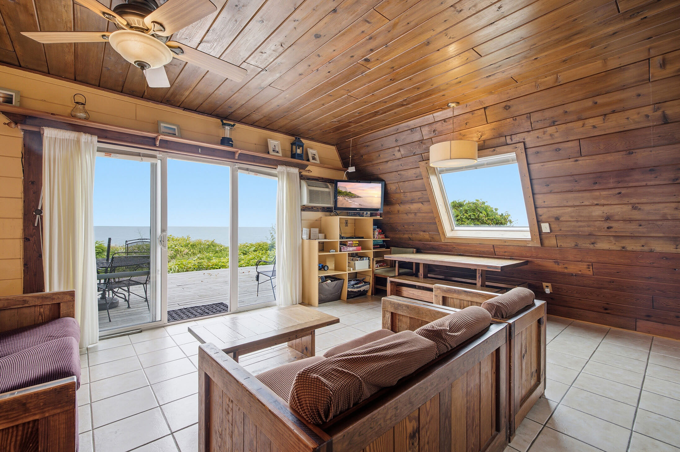 Chalet #8's living room opens to a deck with stunning Lake Michigan views.