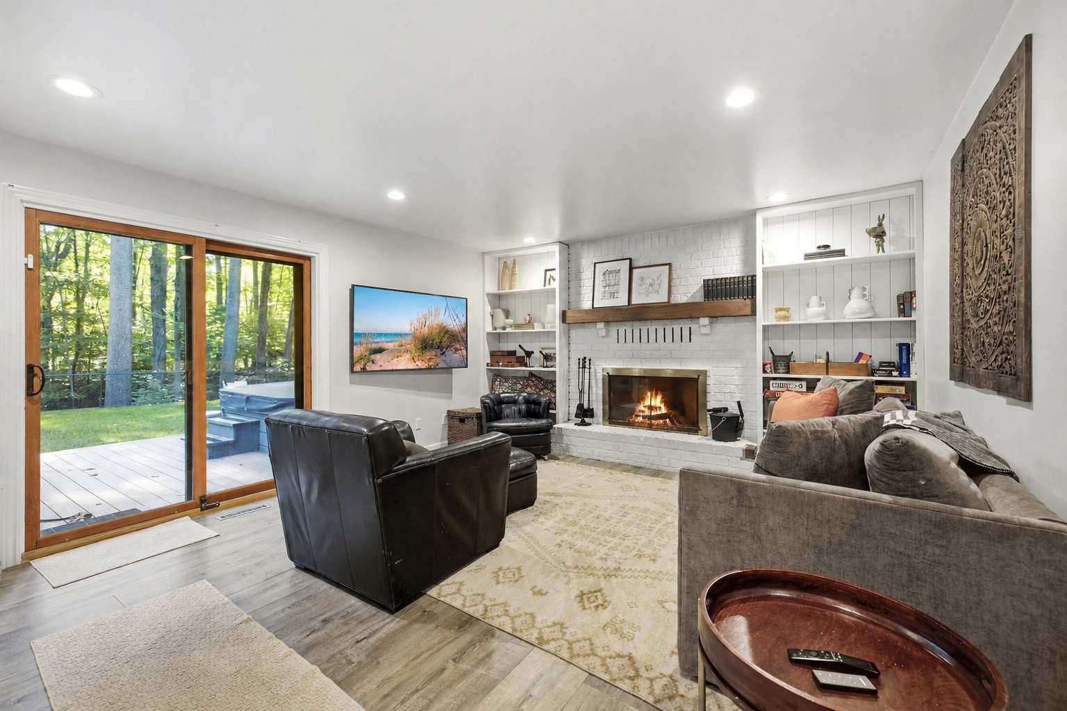 Settle in by the fire with woodland views just beyond the glass.
