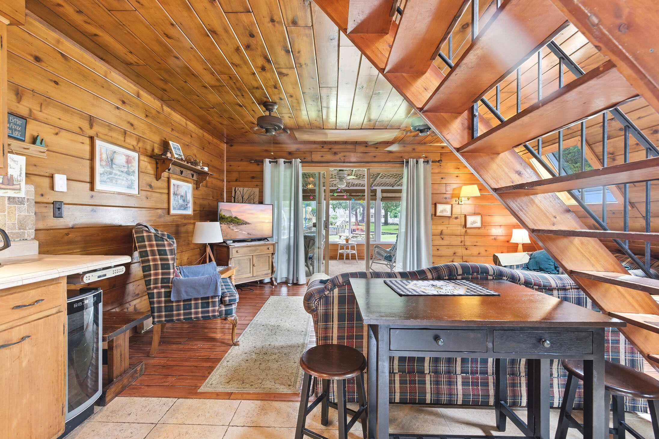 Open layout keeps the kitchen, dining, and living areas connected.