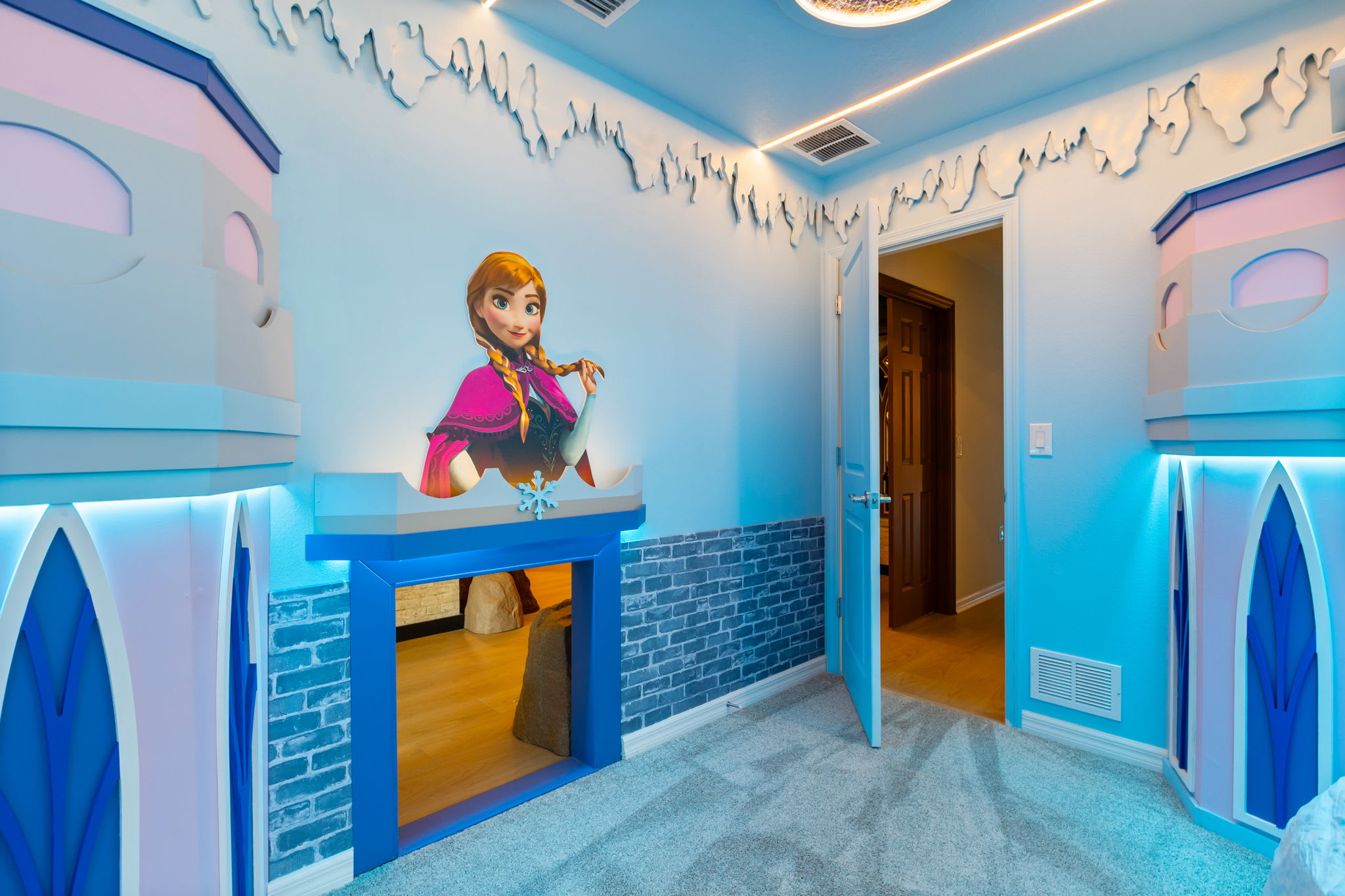Step into a magical Frozen-themed room perfect for kids, featuring enchanting decor and playful elements.