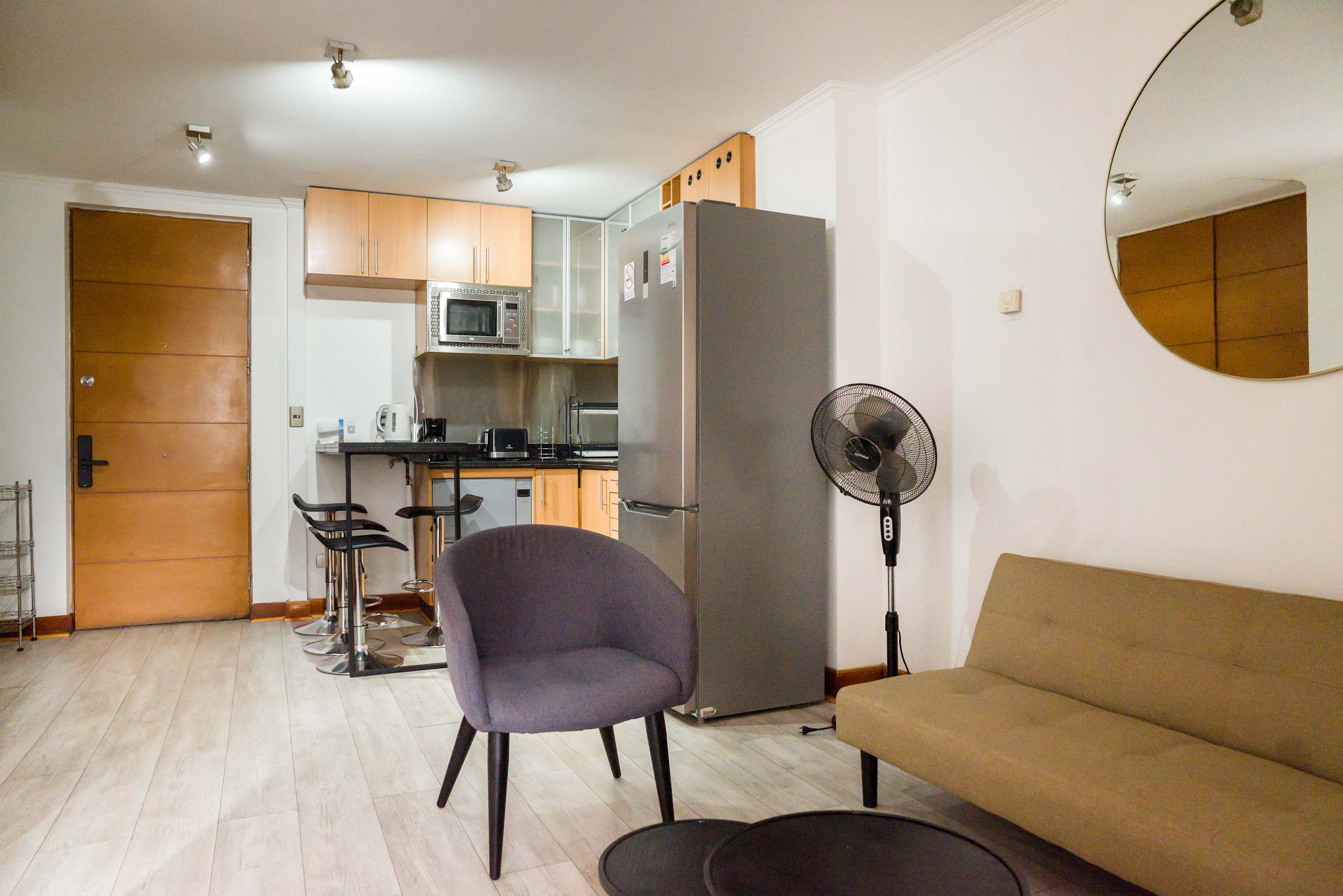 Cozy living space with modern amenities and stylish decor, perfect for a relaxing stay in the heart of the city.