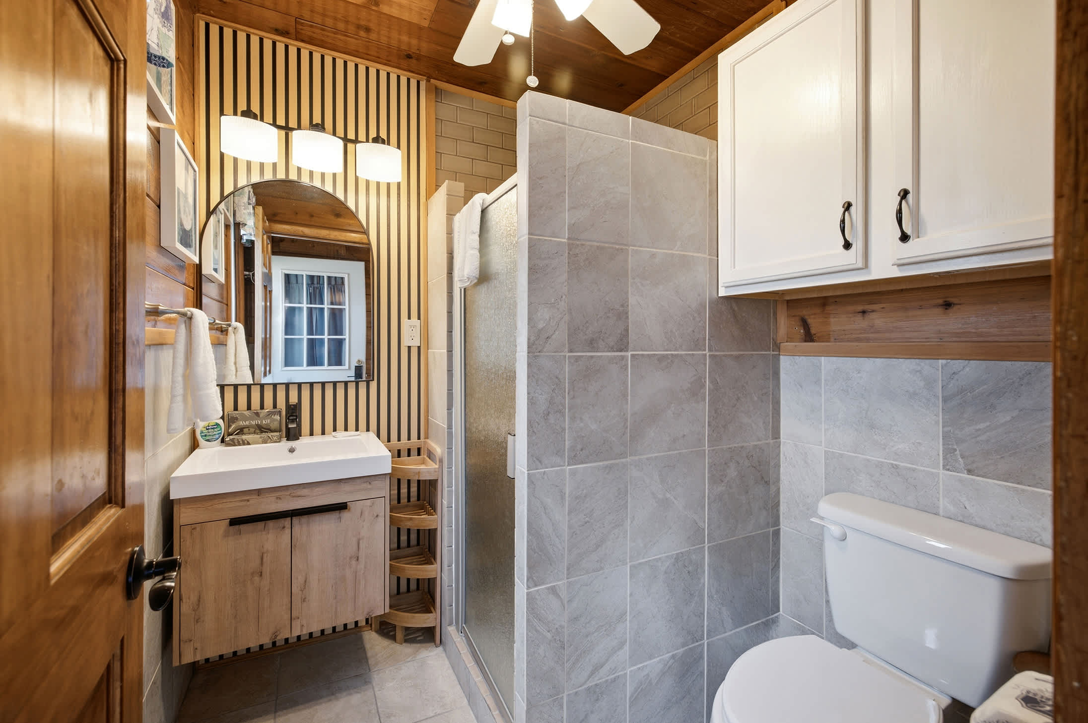 Full bathroom with a walk-in shower and modern vanity for added comfort.