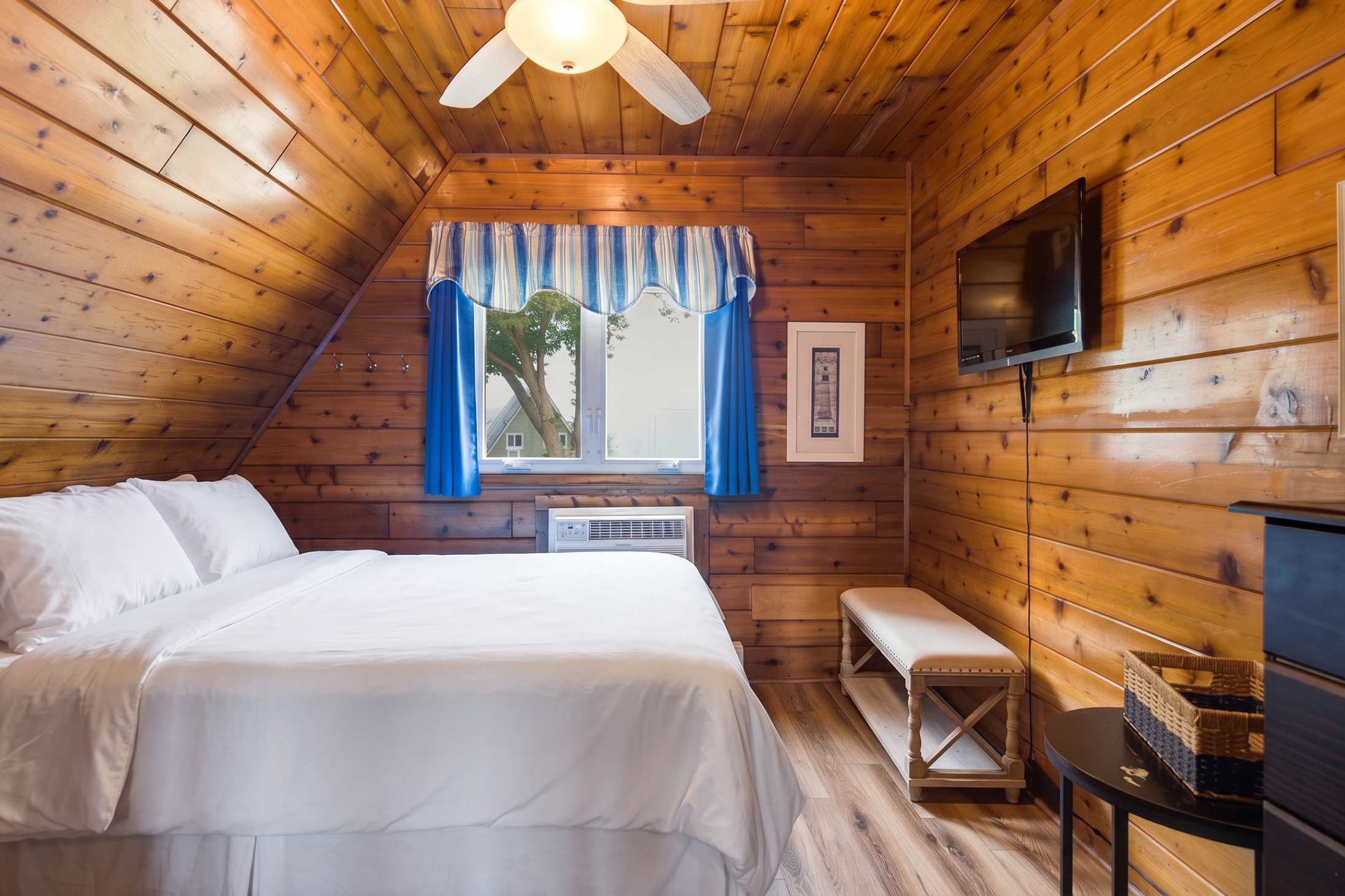 King-sized bedroom with a wall-mounted Smart TV for added comfort.