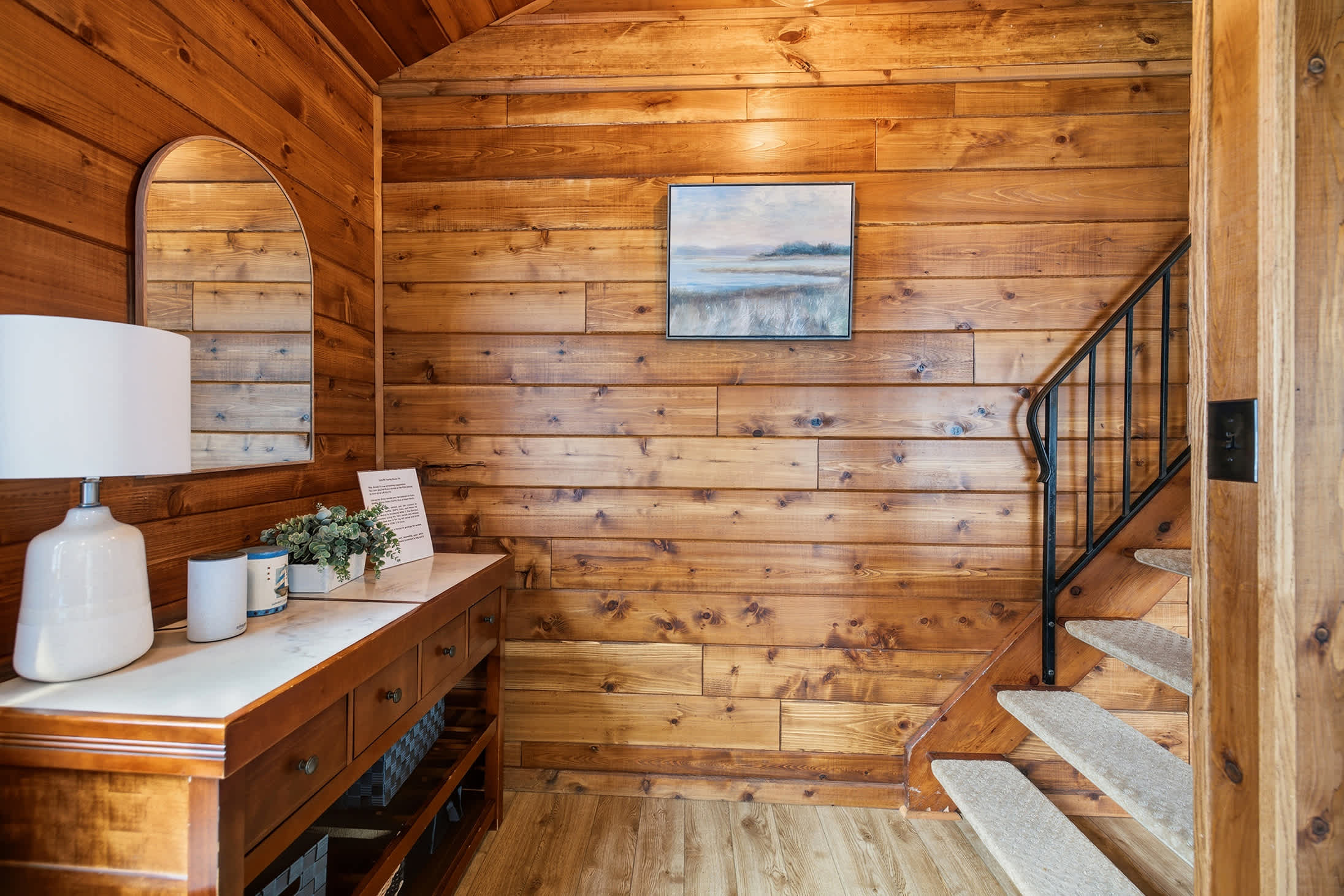 Entryway console and staircase create a welcoming arrival into Chalet 76.