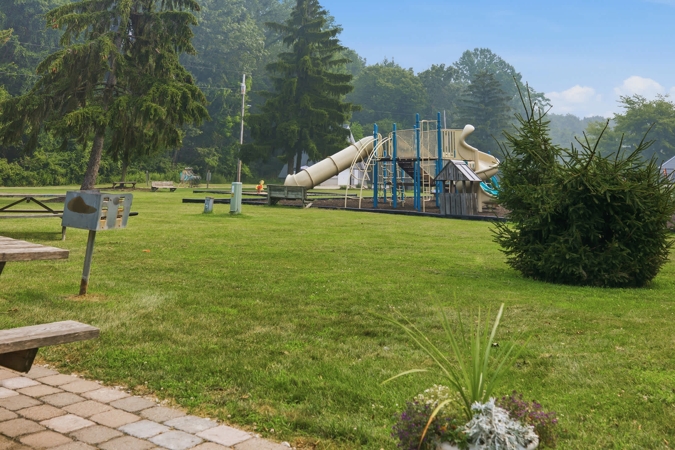 Nearby playground gives kids a dedicated space to climb, slide, and play.