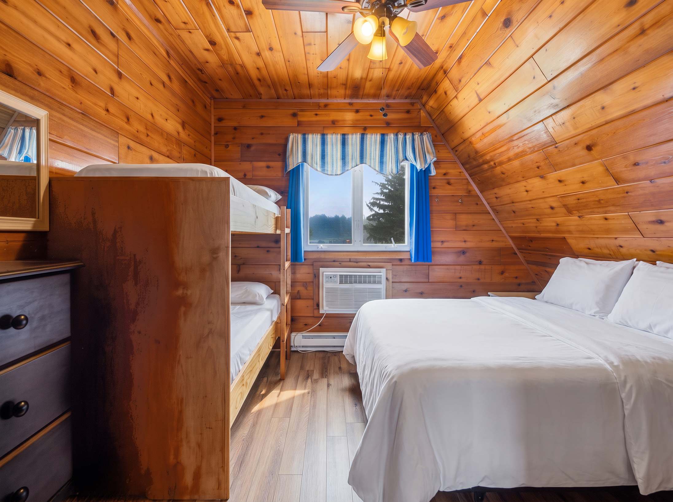Bedroom 2 is on the upper level and has a queen bed and a single bunk bed.