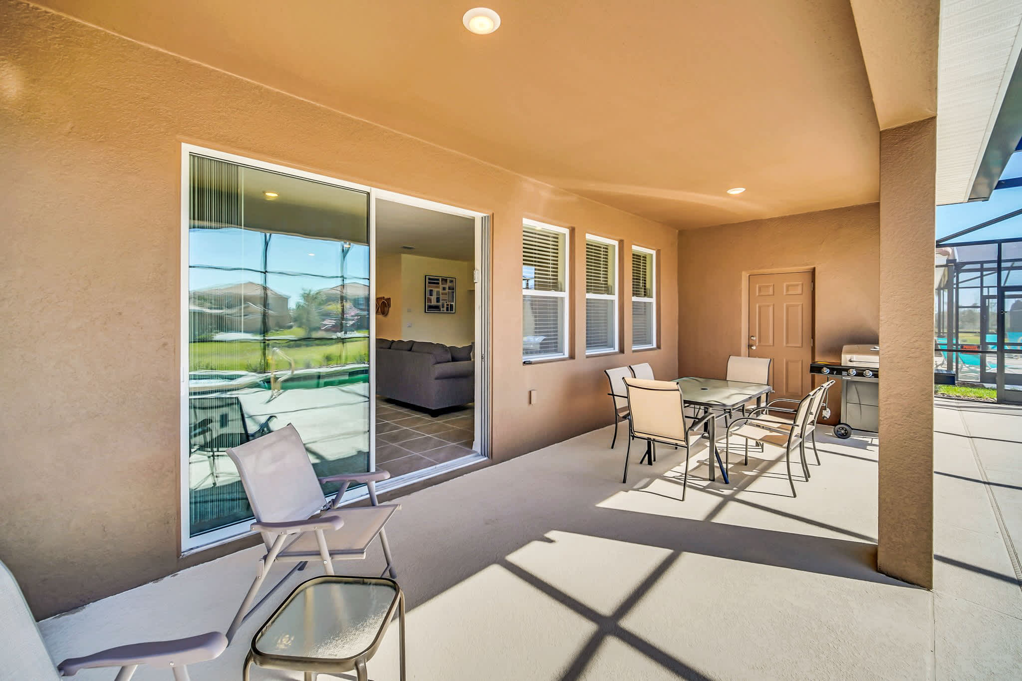Relax on the spacious patio with dining area and grill, perfect for outdoor meals and gatherings.
