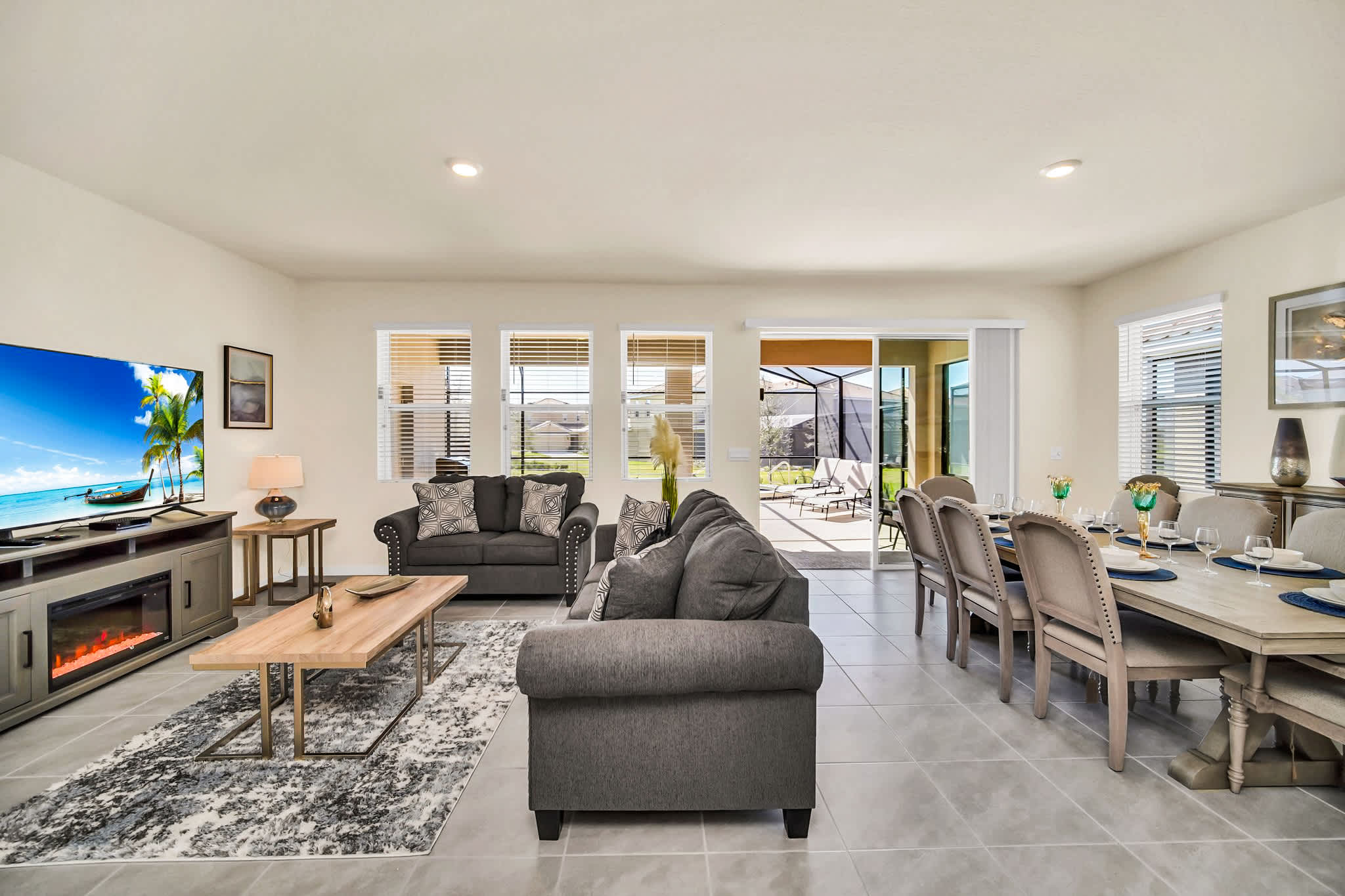Relax in this spacious living and dining area with modern amenities and direct access to a sunny patio.