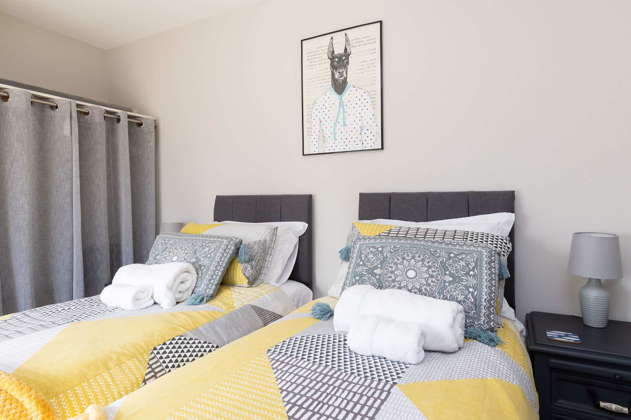 Bright twin bedroom, ideal for families or friends enjoying a relaxing coastal retreat