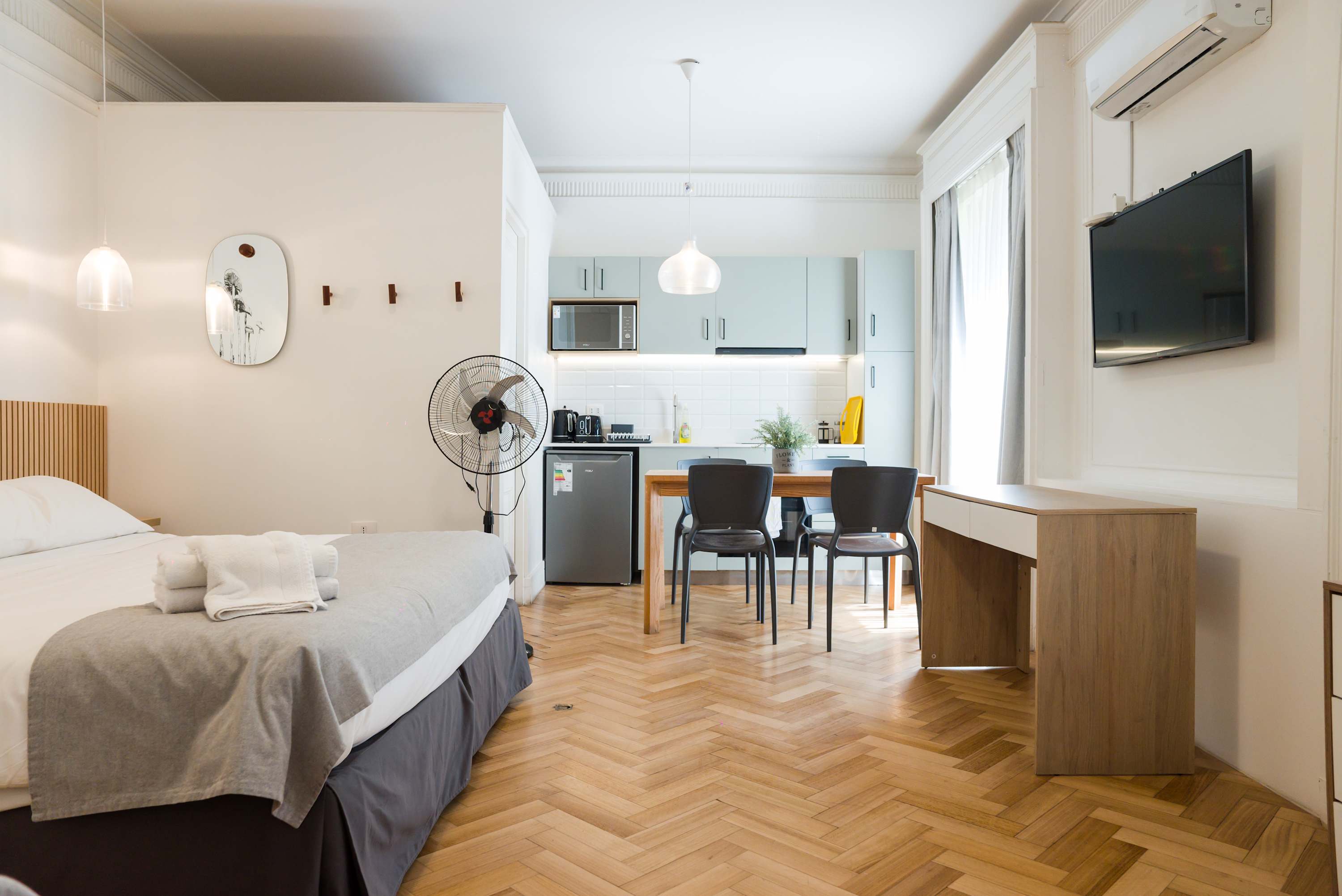 Chic studio apartment with modern amenities and cozy decor, perfect for a comfortable stay in the heart of the city.