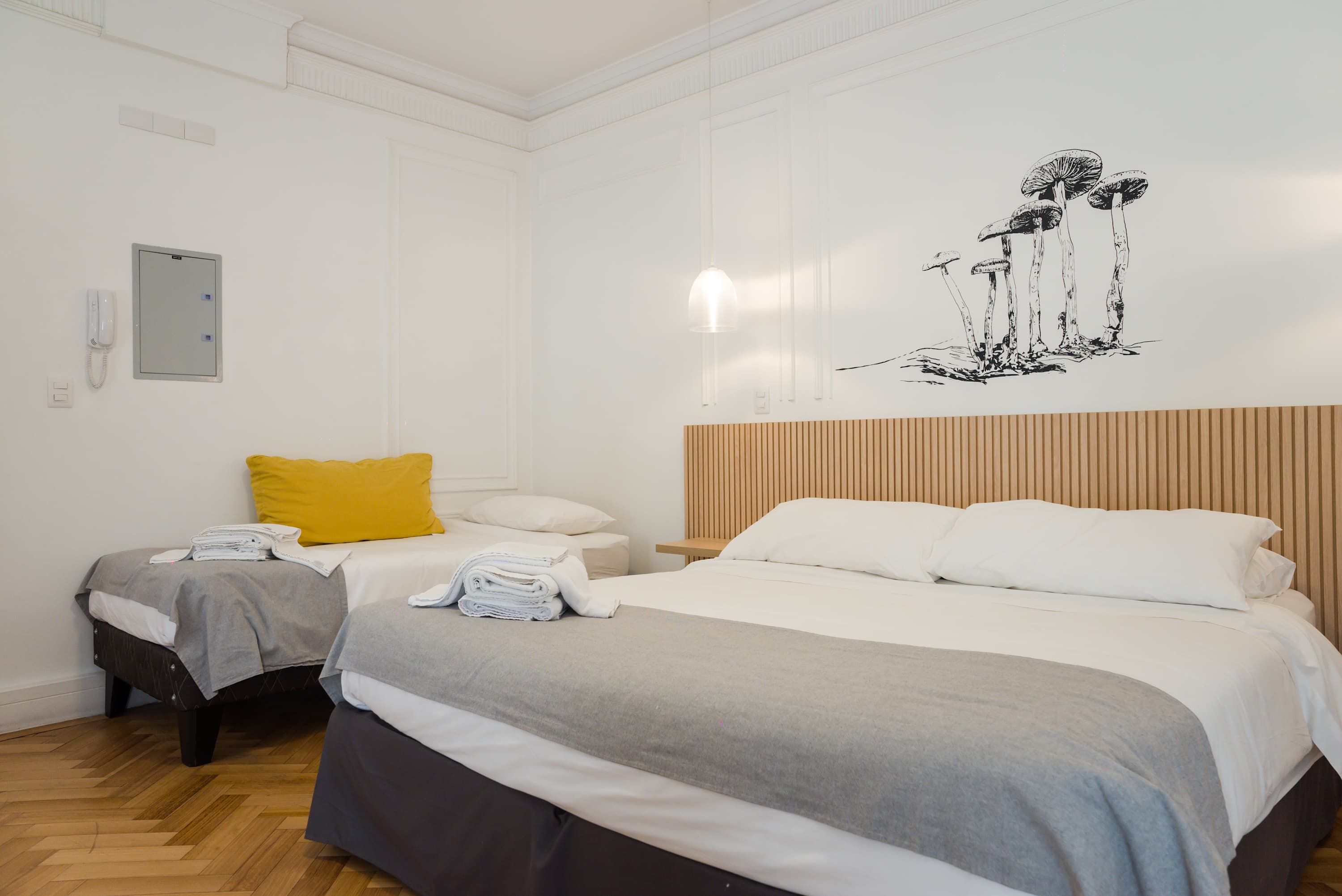 Relax in this stylish studio with cozy beds and unique decor, perfect for a comfortable stay in the heart of the city.
