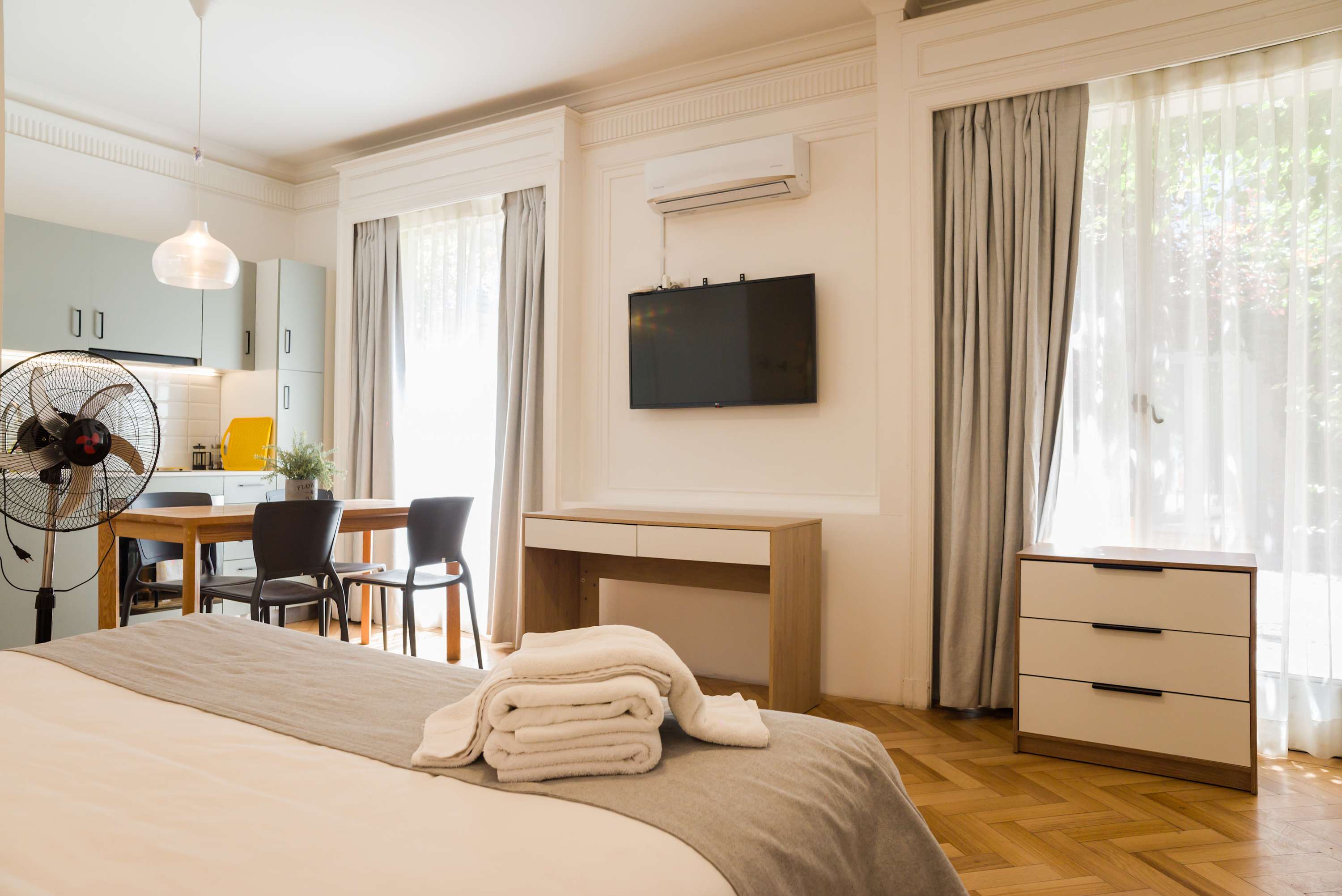 Bright and airy studio with modern amenities and cozy dining area, perfect for a comfortable stay in the heart of the city.
