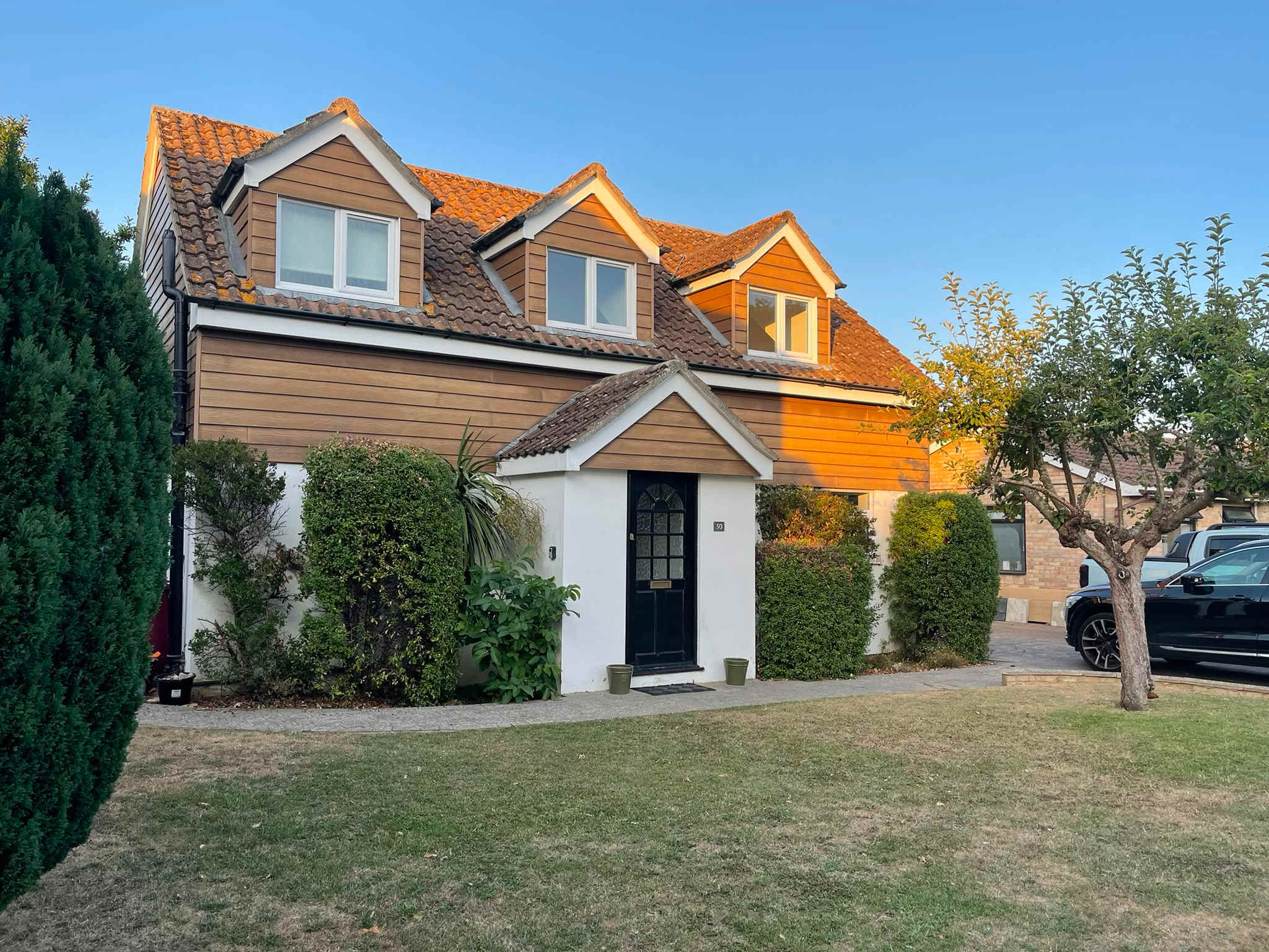 The front of the house bathed in evening sunshine
