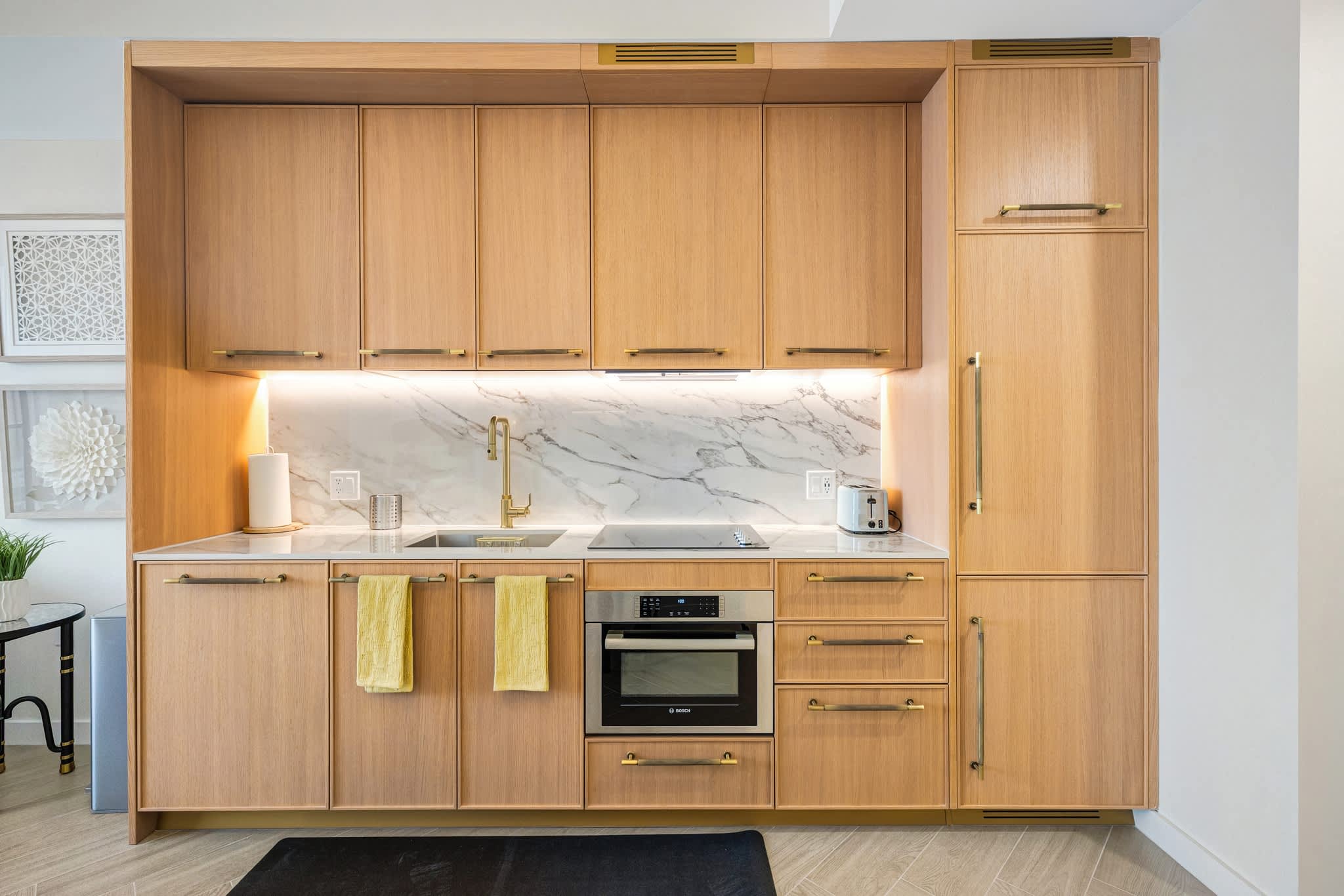 Sleek and modern kitchen with high-end appliances and stylish finishes, perfect for cooking and dining in.