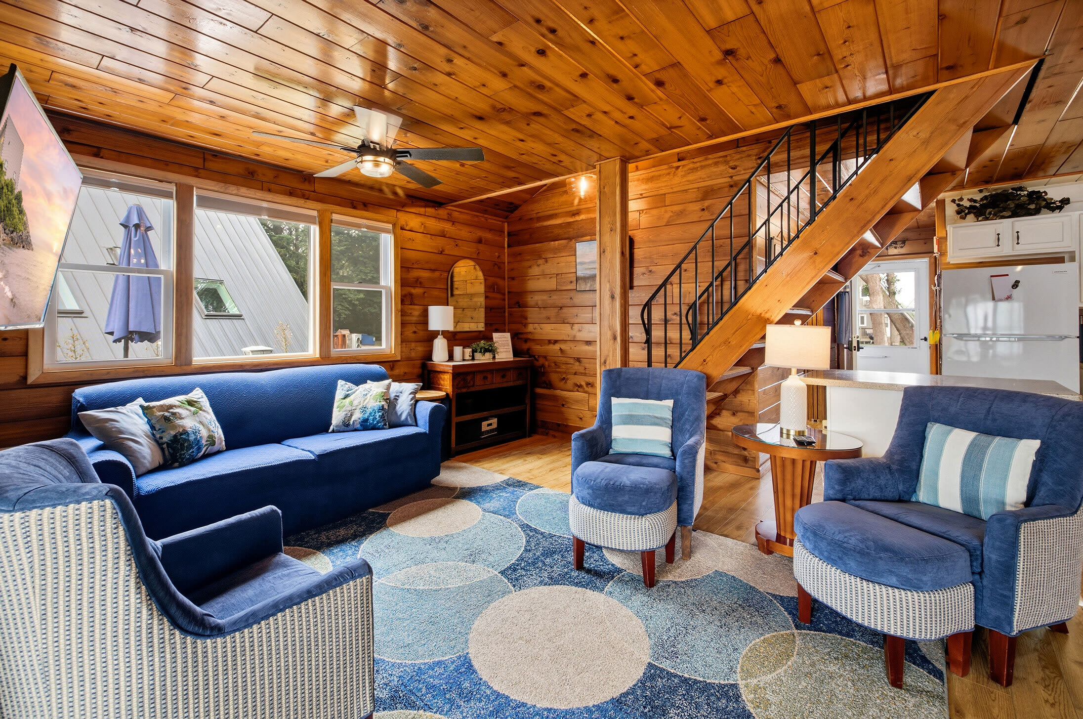 Spacious gathering area with open flow between the living room and kitchen.
