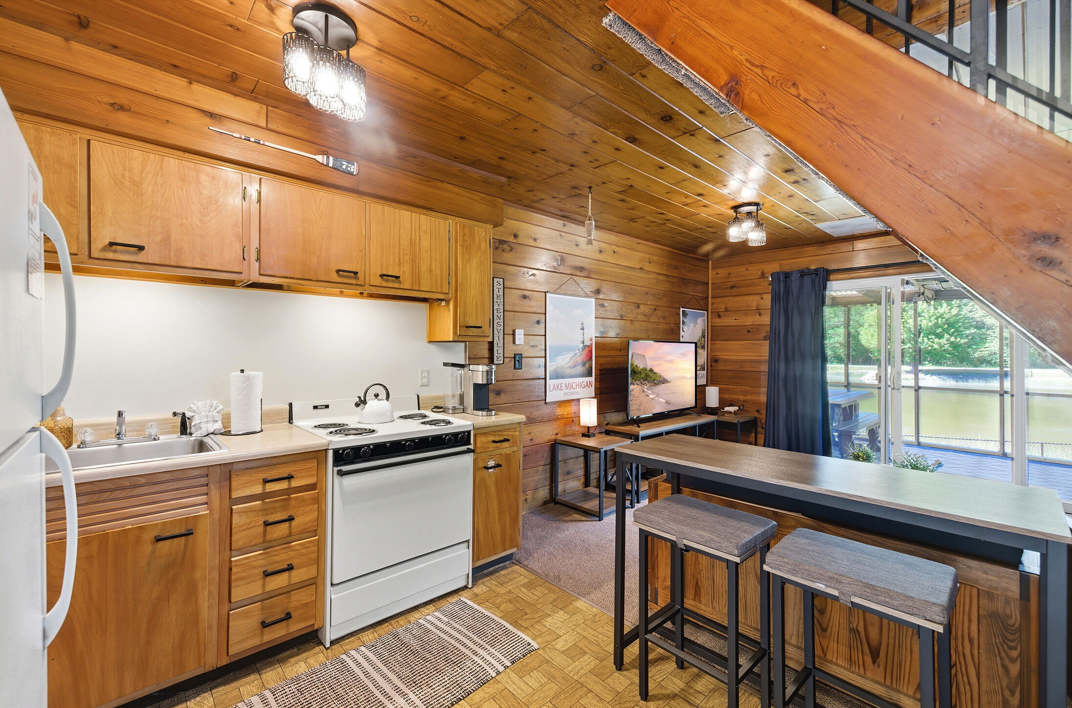 Open concept kitchen and seating area for convenient vacation living.