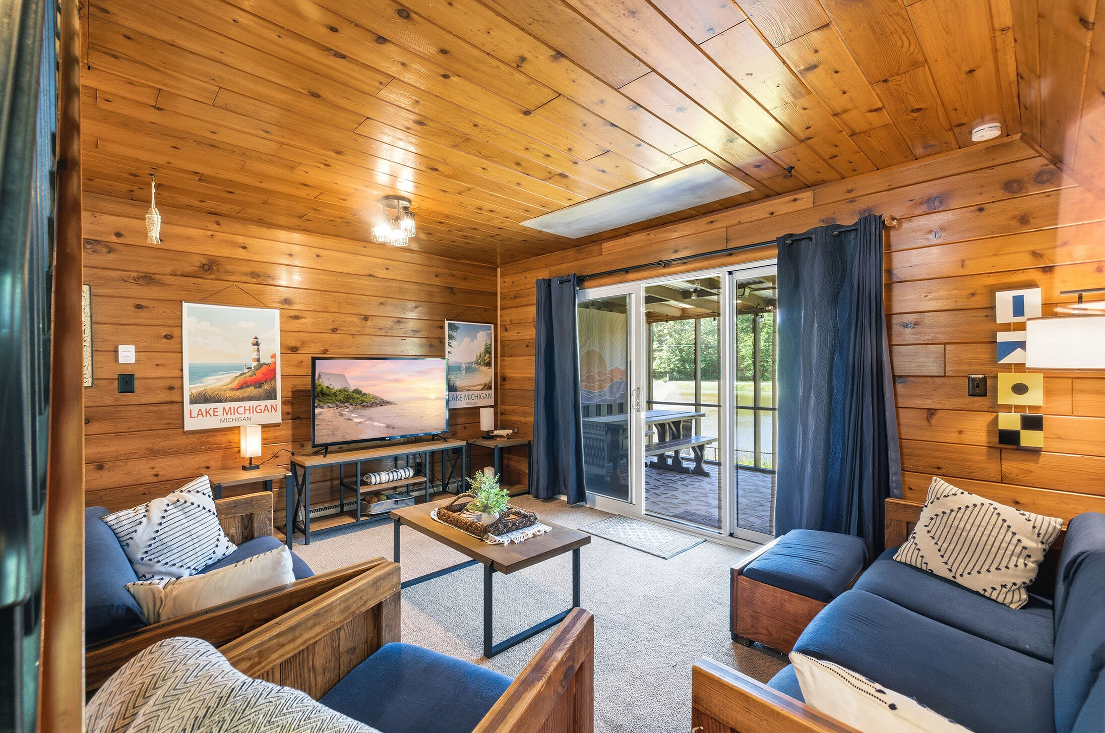Living room with screened porch access for extended gathering space.