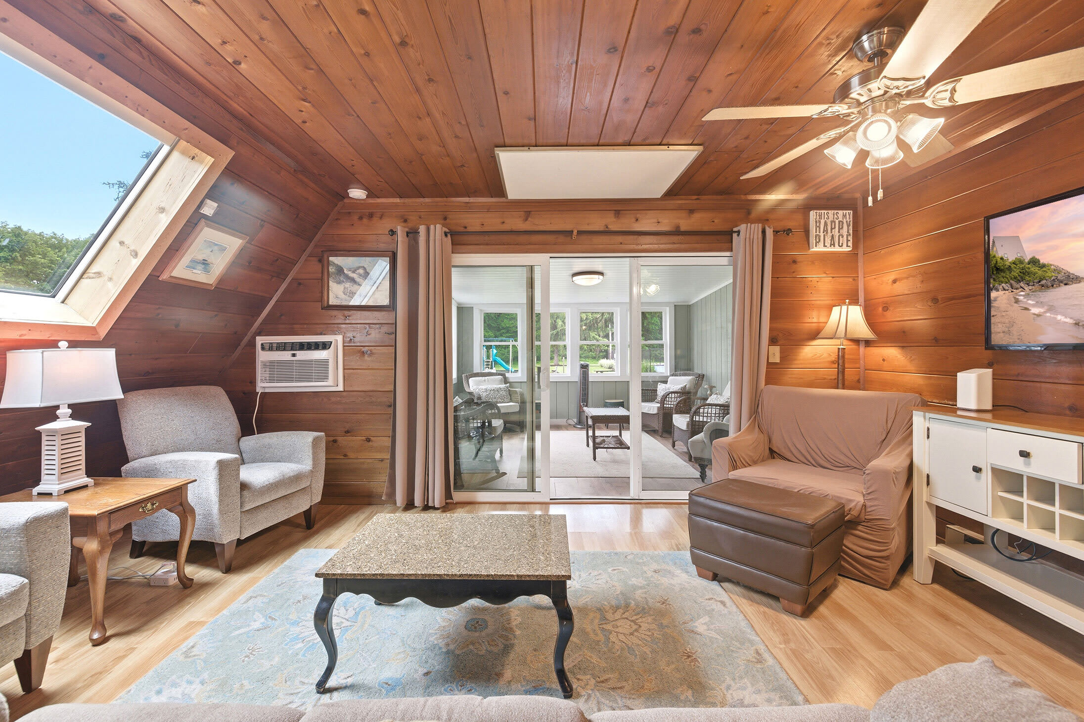 The living area connects directly to the sunroom, creating extra space to spread out.