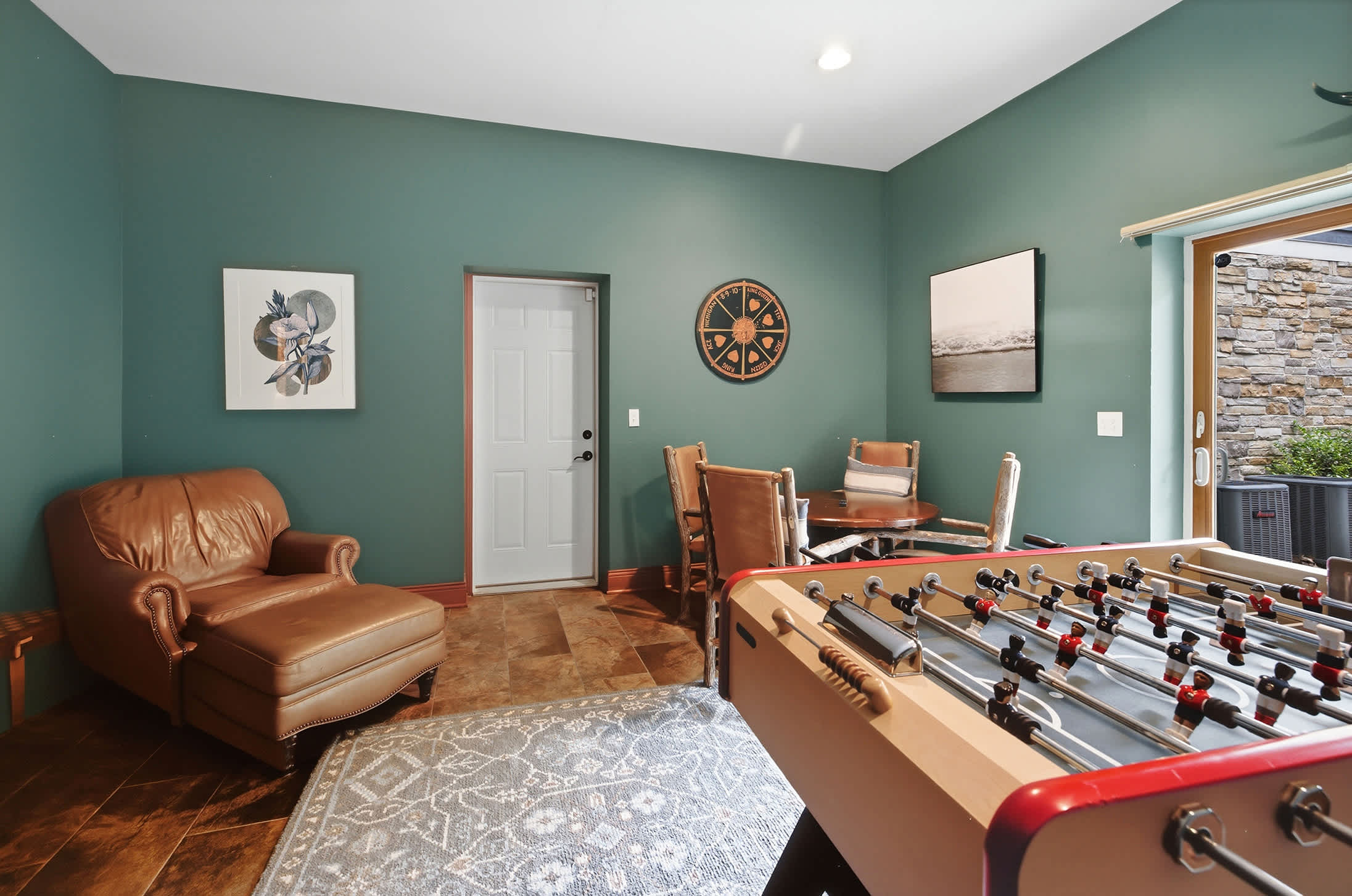 A game room with foosball table and other activities provides entertainment for everyone.