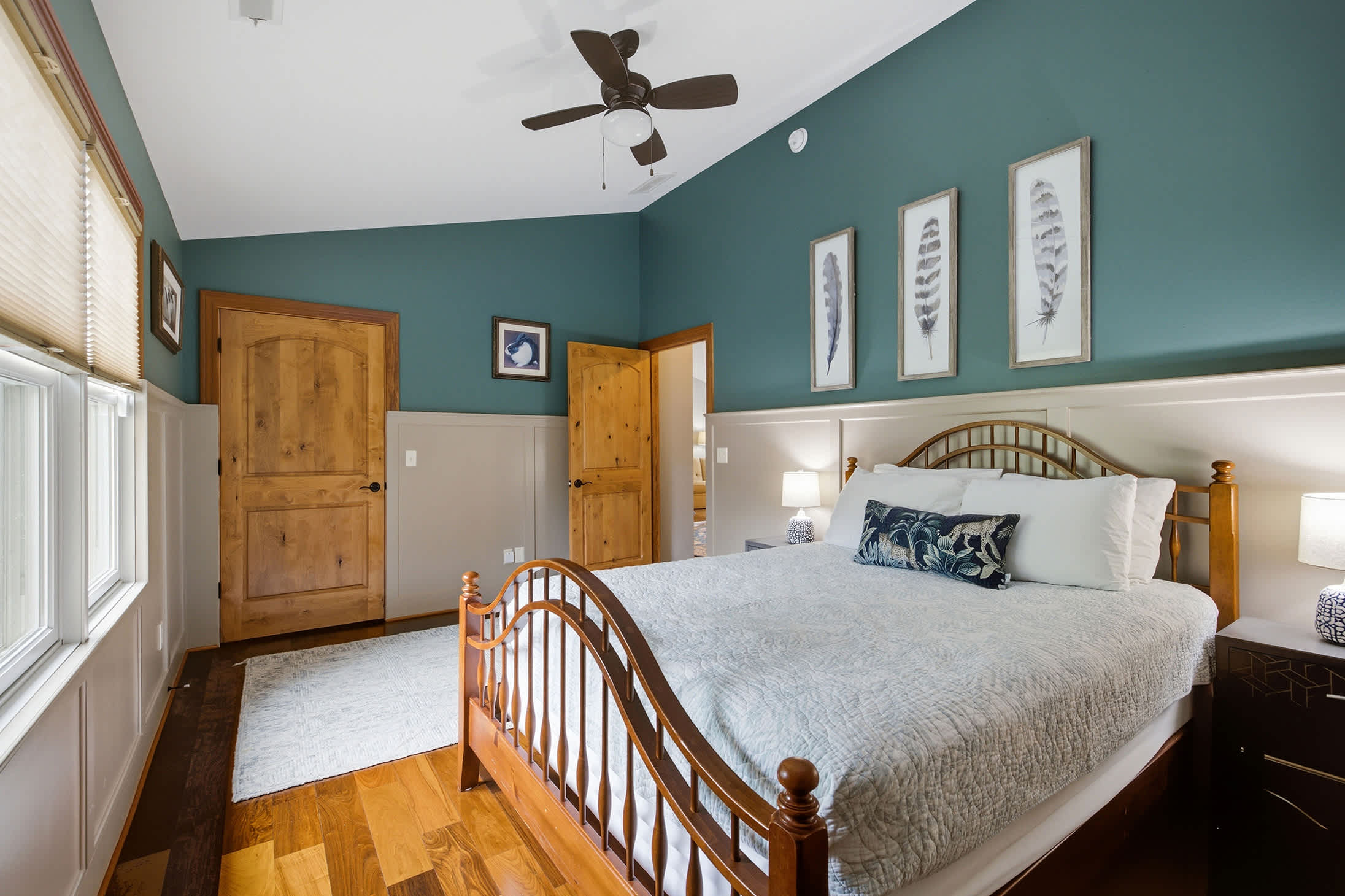 Bedroom 5 features vaulted ceilings and natural light for a relaxing stay.
