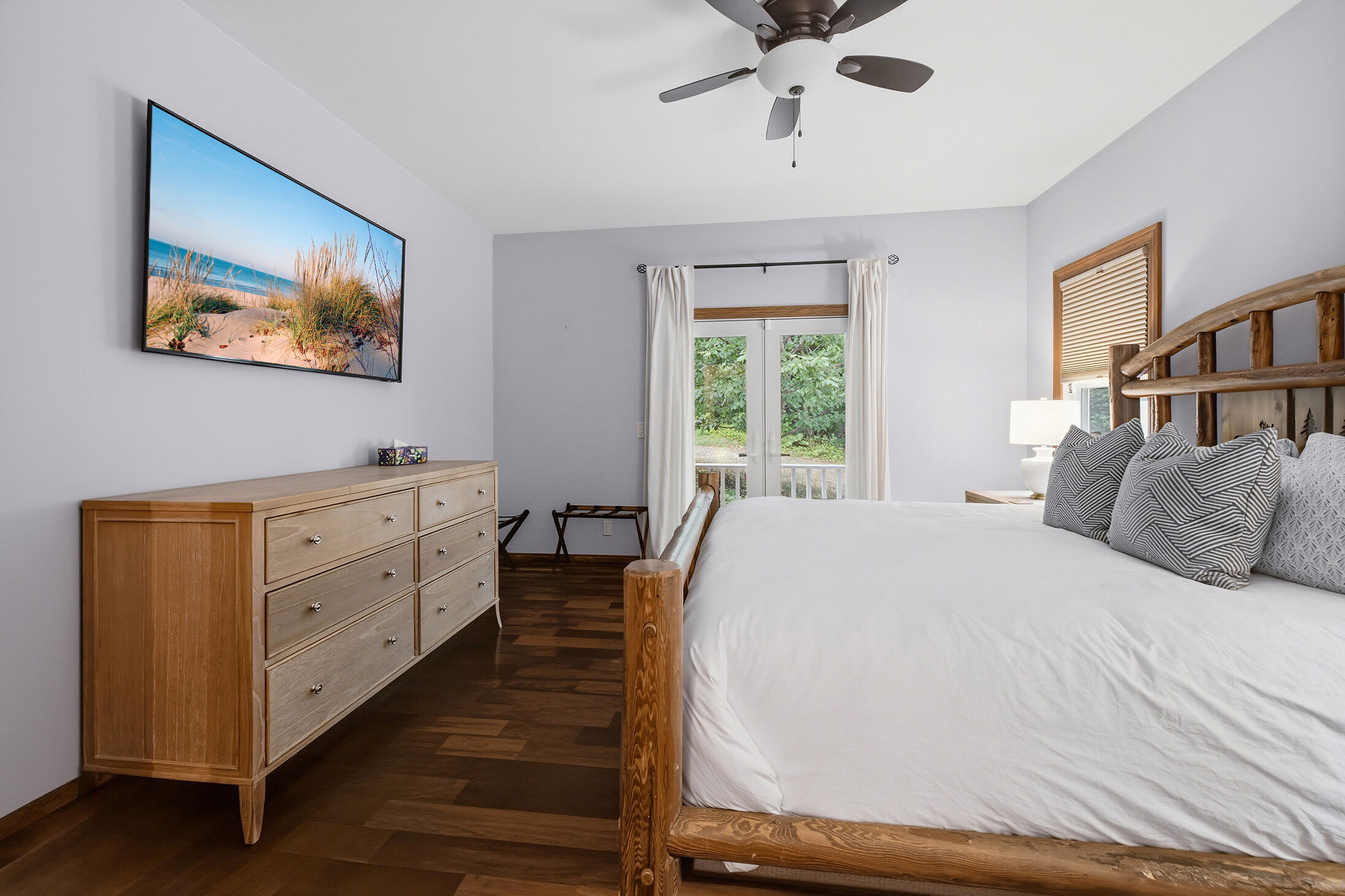 Enjoy bright views through double doors leading to a peaceful balcony.