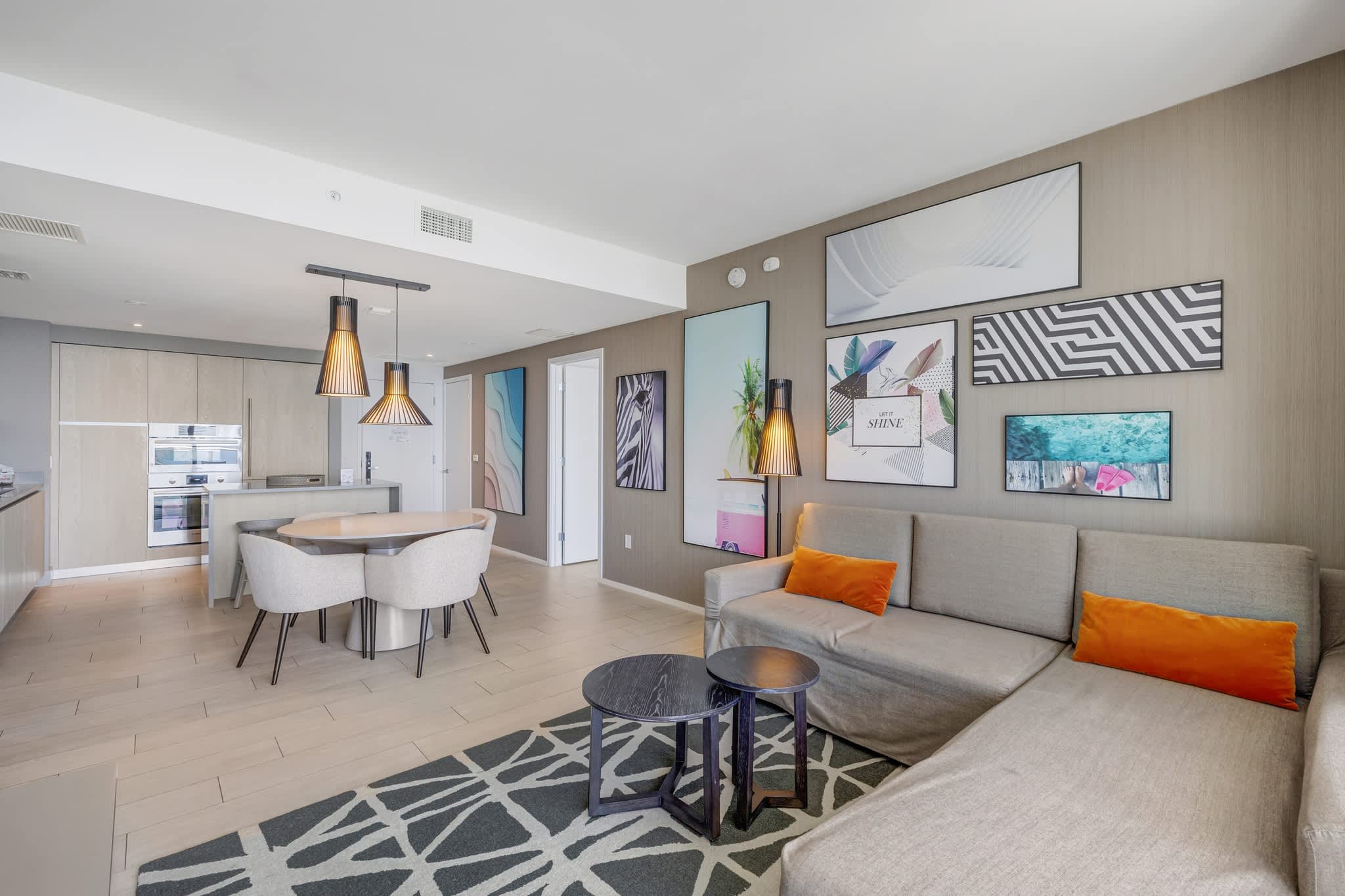 Stylish living area with modern decor, perfect for relaxation and dining. Enjoy the comfort and elegance of this inviting space.