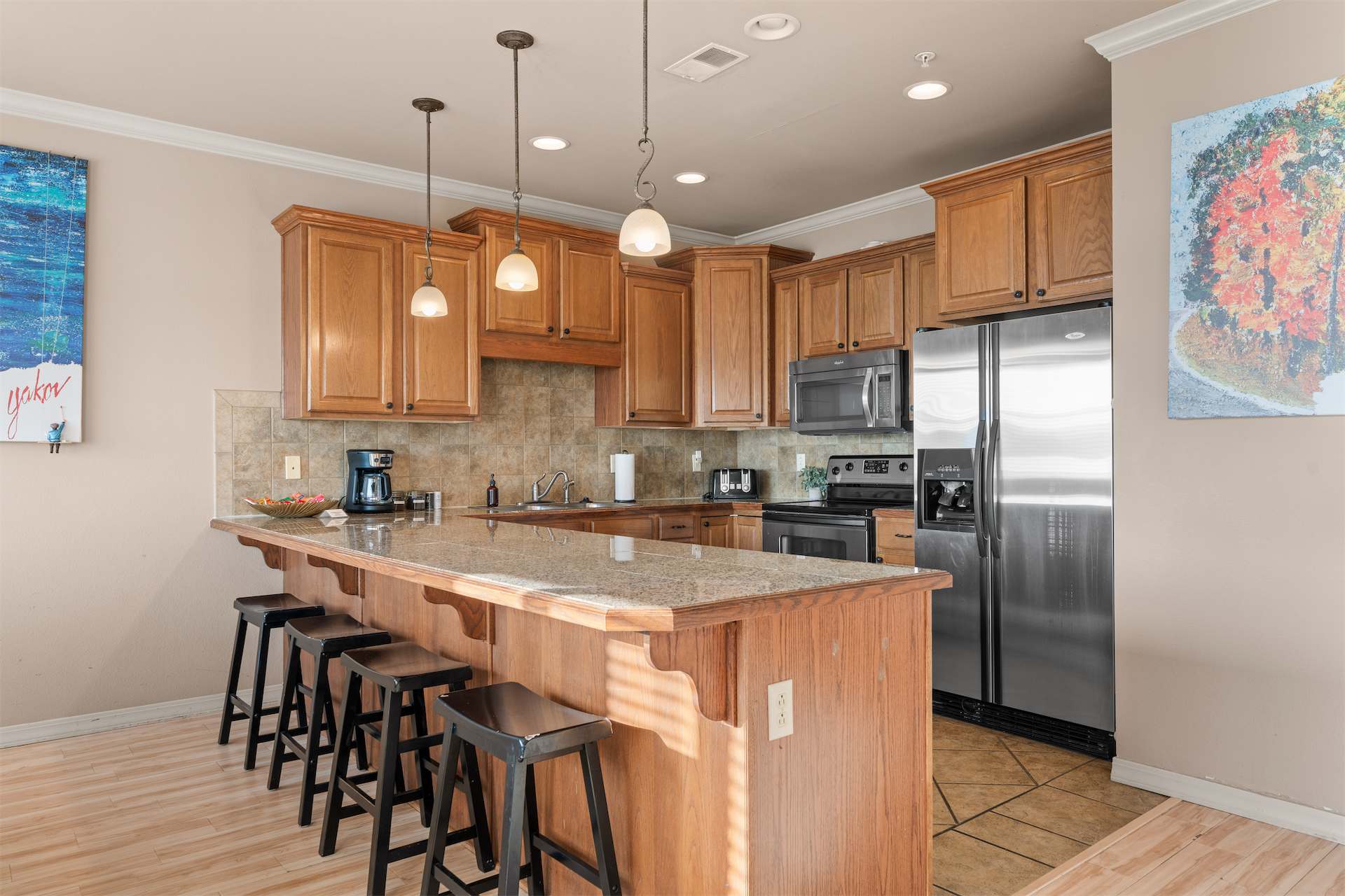 The open kitchen offers ample space & all the comforts of home​