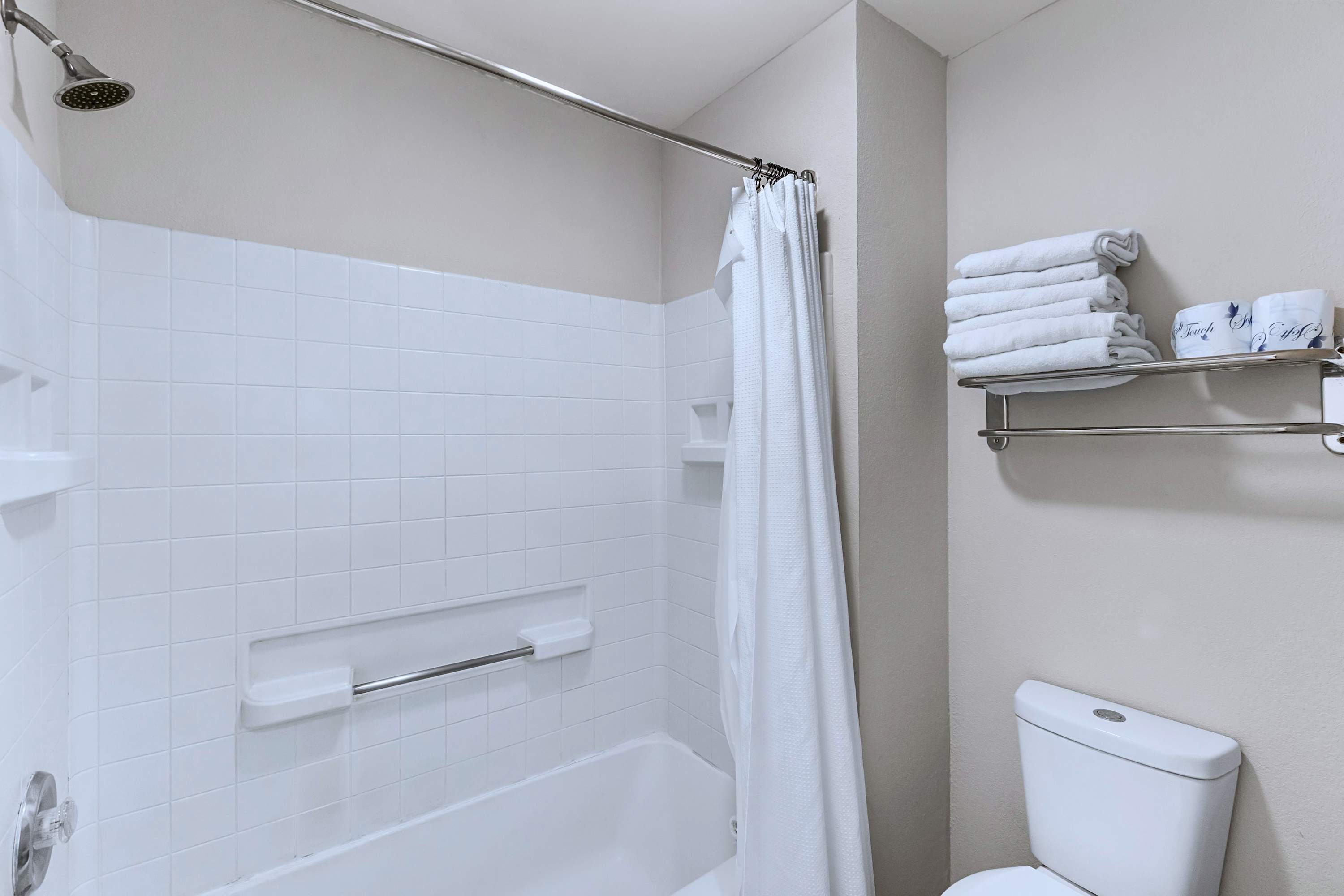 Unwind with a warm soak! Full bathtub with shower and private toilet