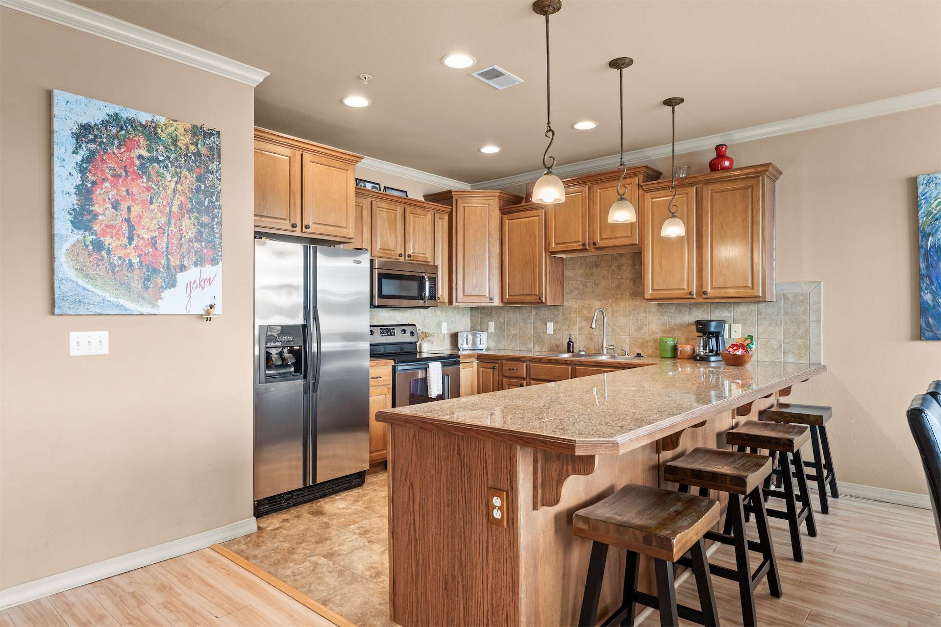 The open kitchen offers ample space & all the comforts of home​