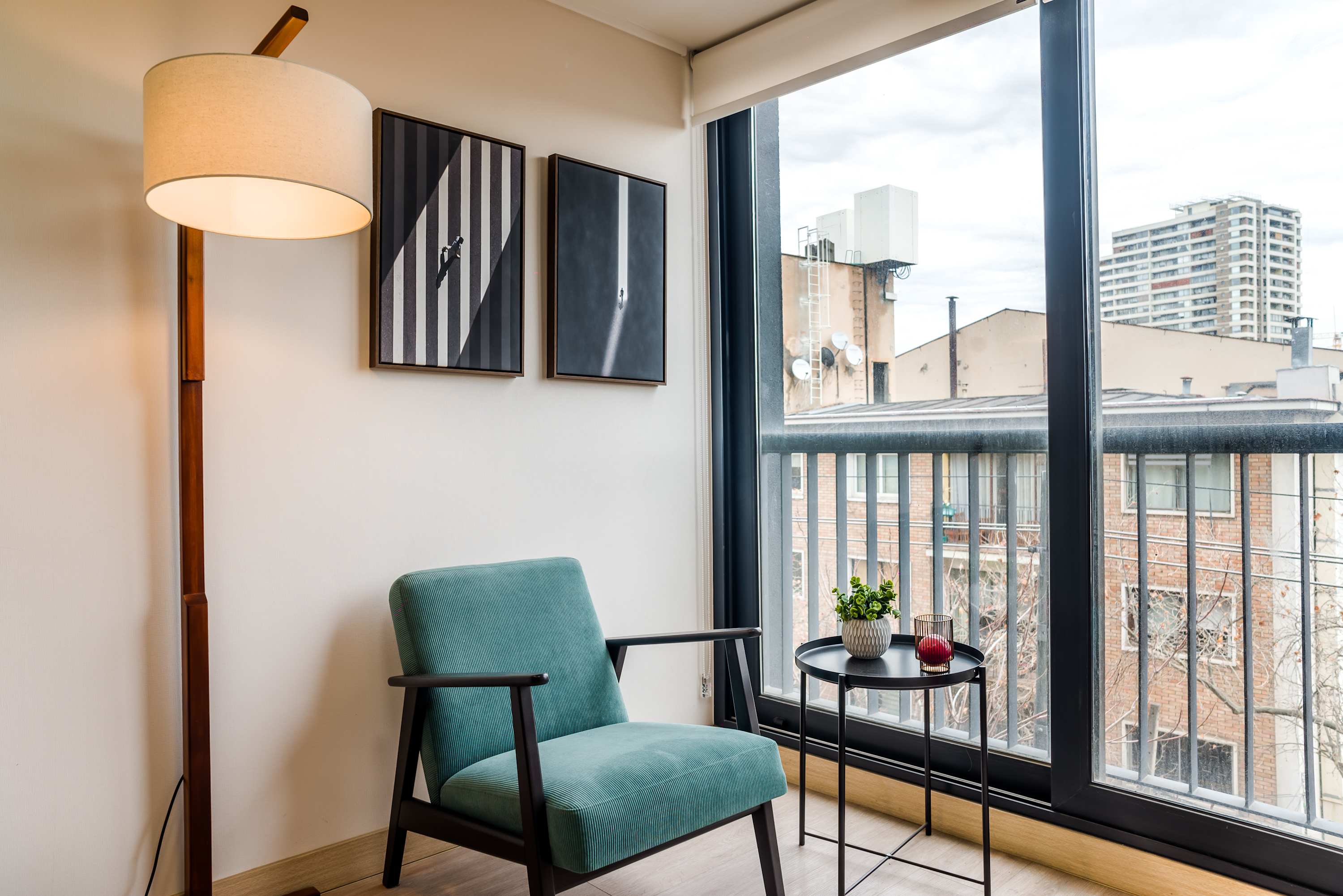 Relax in this cozy nook with city views, perfect for unwinding after a day of exploring.