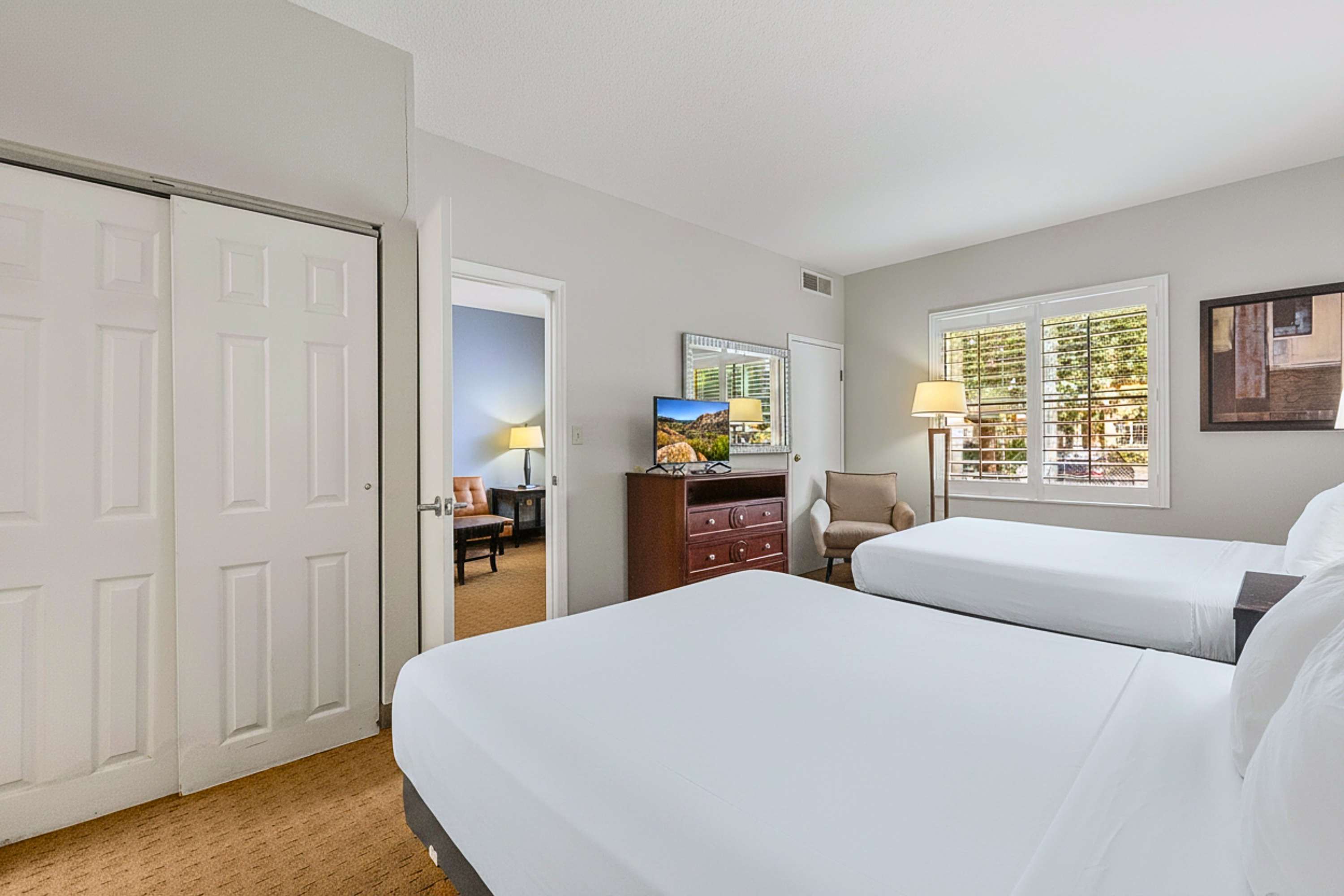 Two queen beds, smart TV, and side couch, your ultimate relaxation zone!