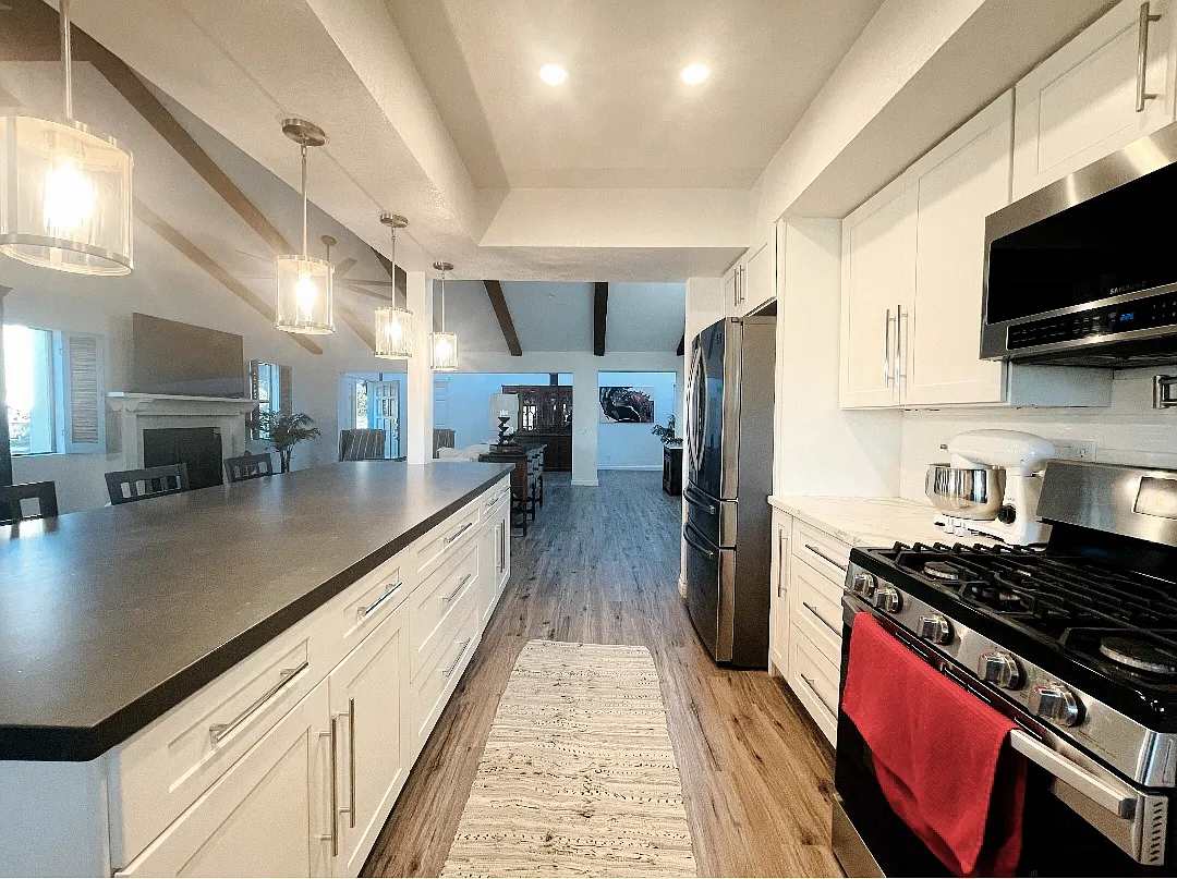 Kitchen with large island connecting to the dining room
