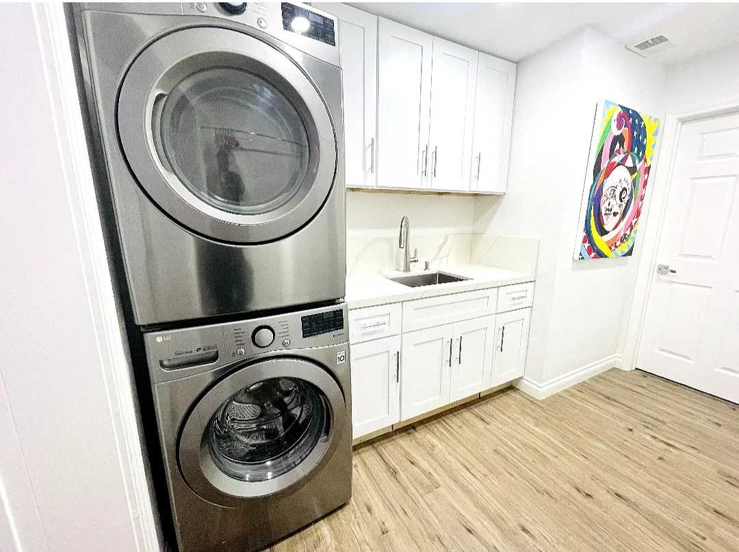 Laundry / Wash Room with ample storage; available connection between Main House and attached junior ADU.