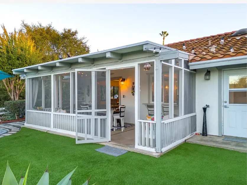 Exterior view of screen enclosed sunroom patio