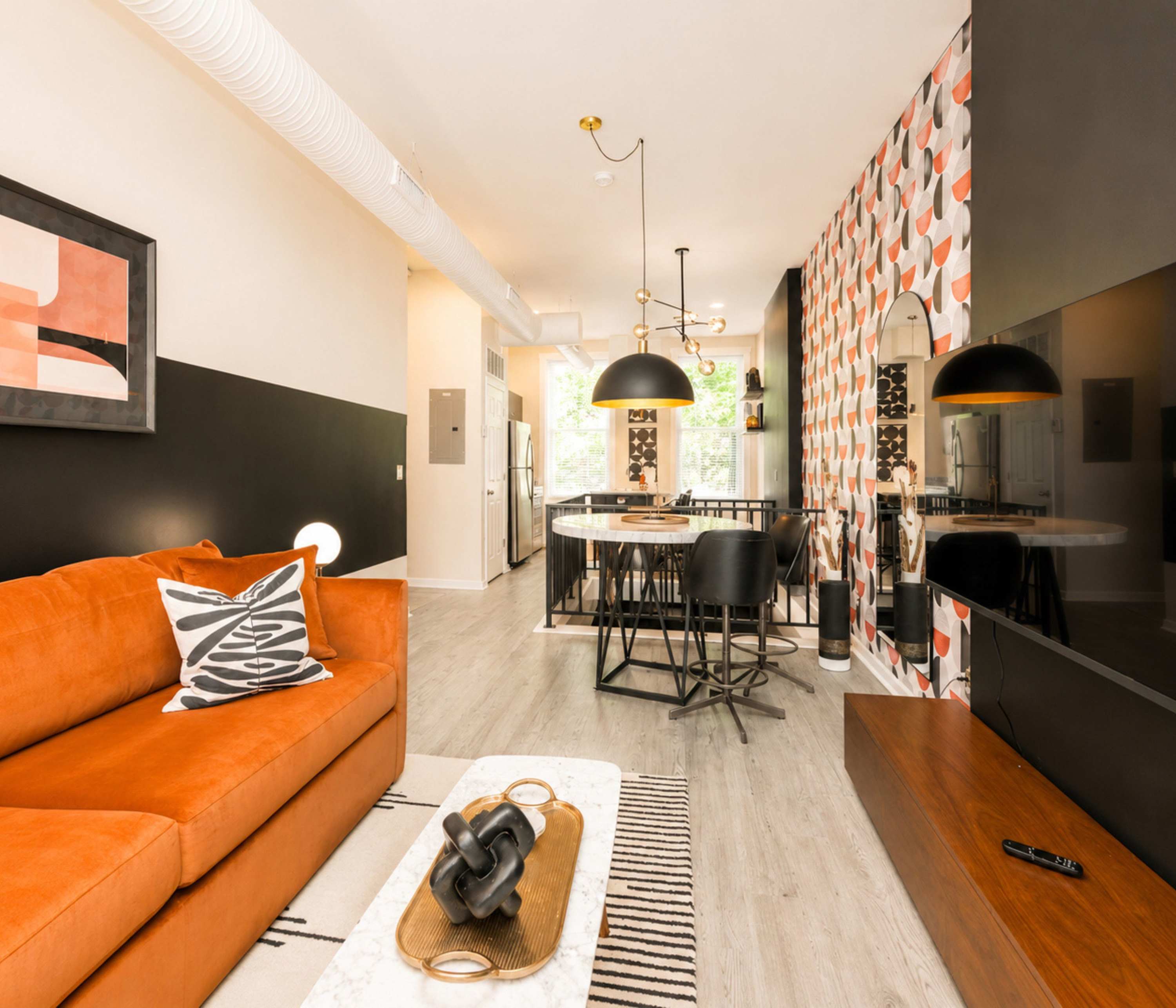 Curl up in the chic living room & stream your favorites on the smart TV