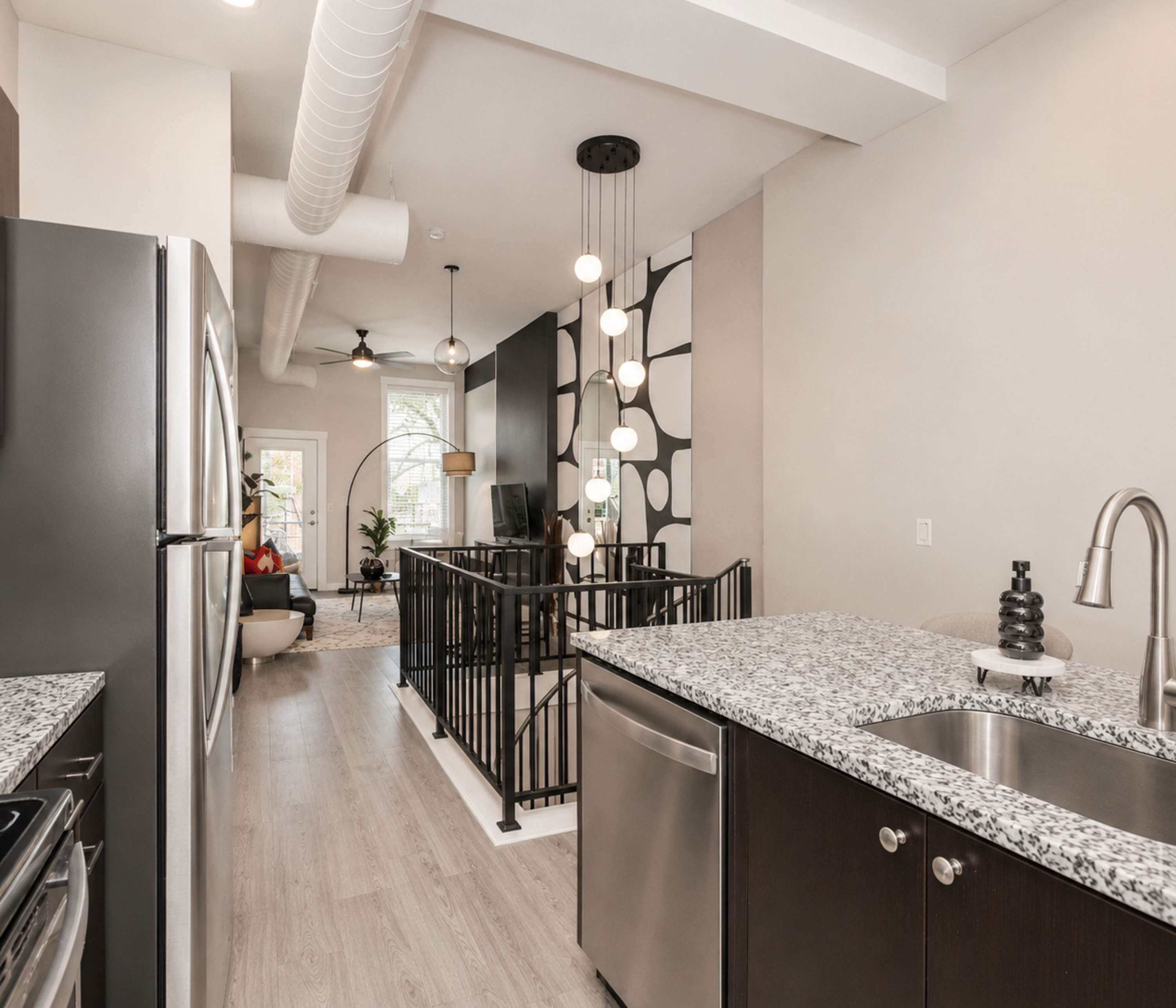 The chic, open kitchen offers loads of room & all the comforts of home
