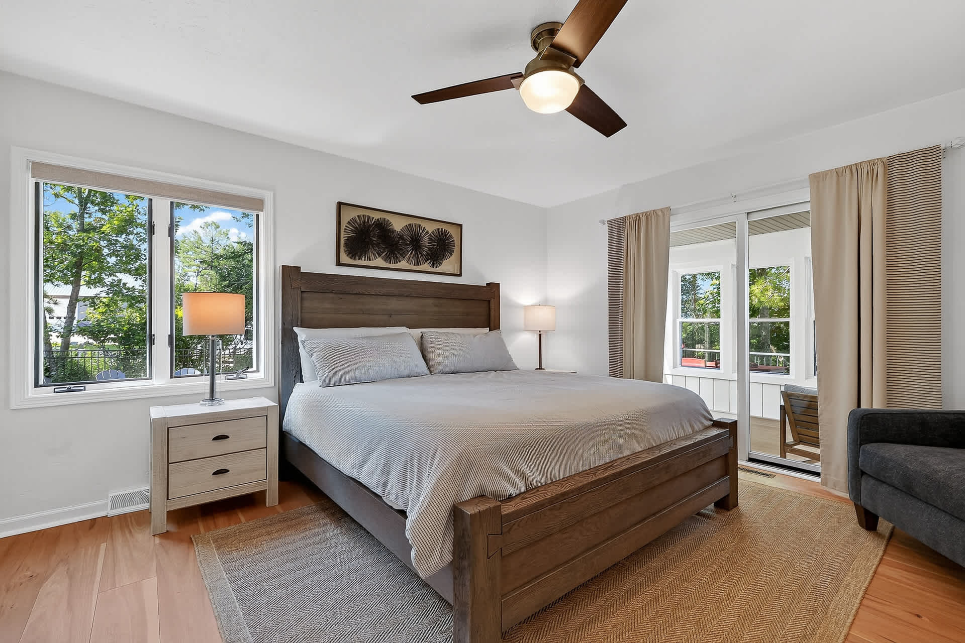 Primary bedroom with ensuite bathroom. Patio door leads to the sun room over looking the bay