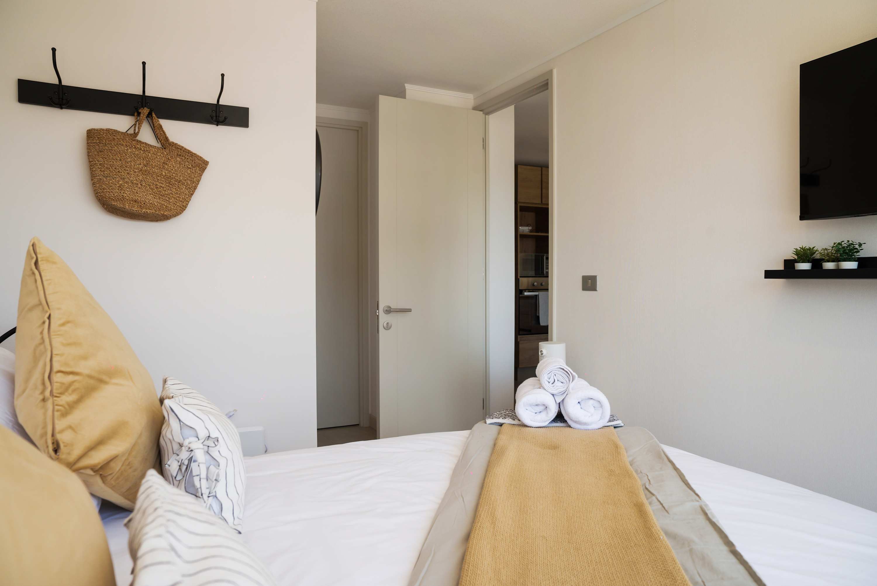 Cozy bedroom with modern amenities and a welcoming touch, perfect for a relaxing stay.