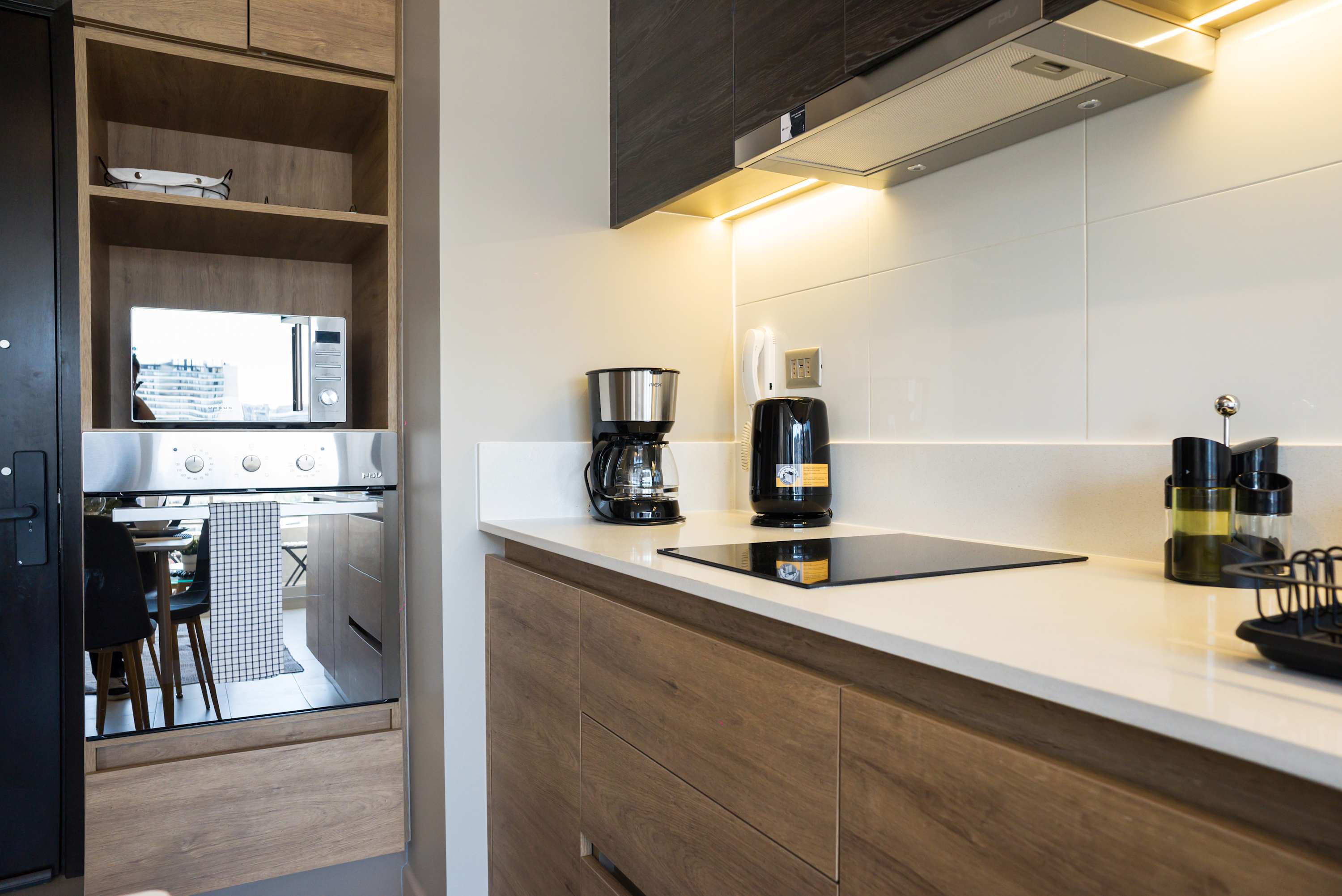 Sleek and modern kitchen with all essentials for a comfortable stay in Santiago.