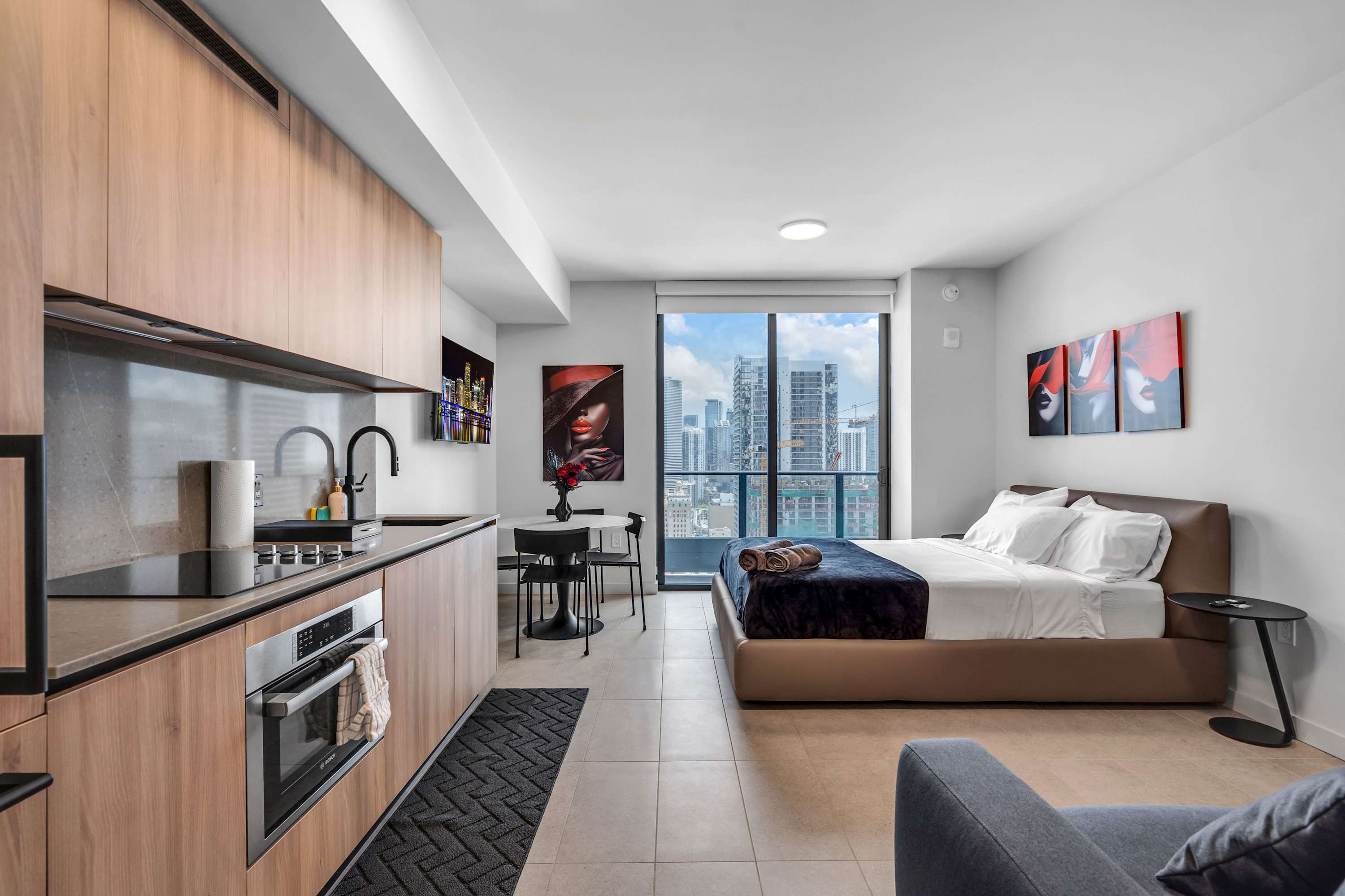 This chic studio boasts a queen-sized bed, smart TV, kitchenette, & full bath​