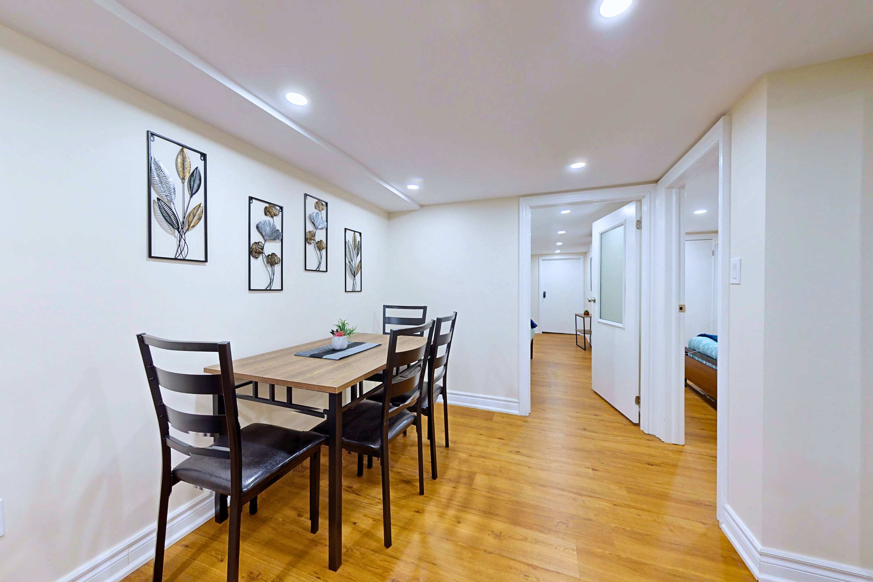 Clean dining setup with seating for 4 guests.