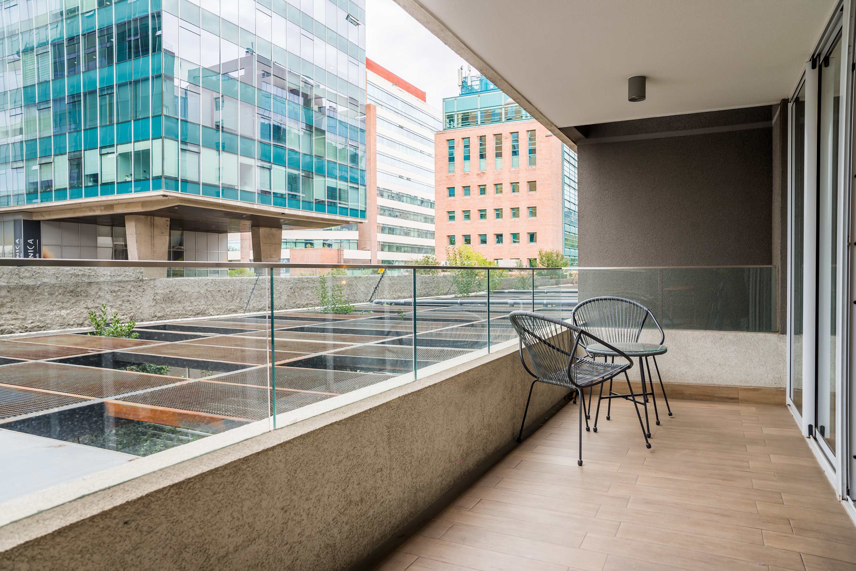 Relax on the private balcony with city views, perfect for morning coffee or evening drinks.