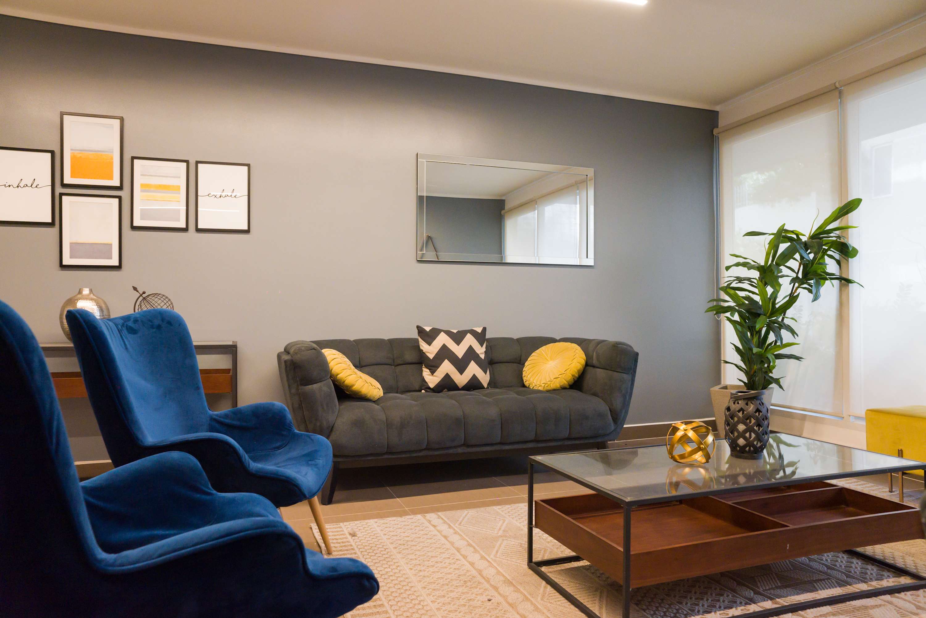 Chic and cozy living area with stylish seating and modern decor, perfect for relaxation.