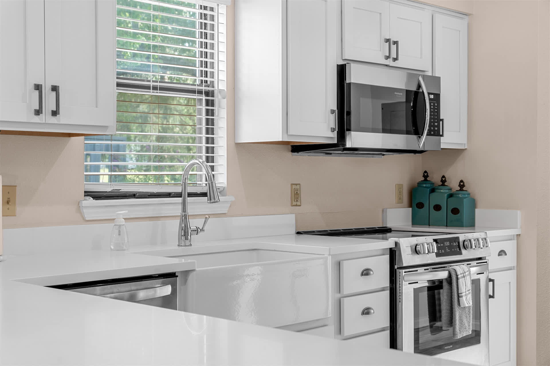 The airy kitchen offers ample space & all the comforts of home​