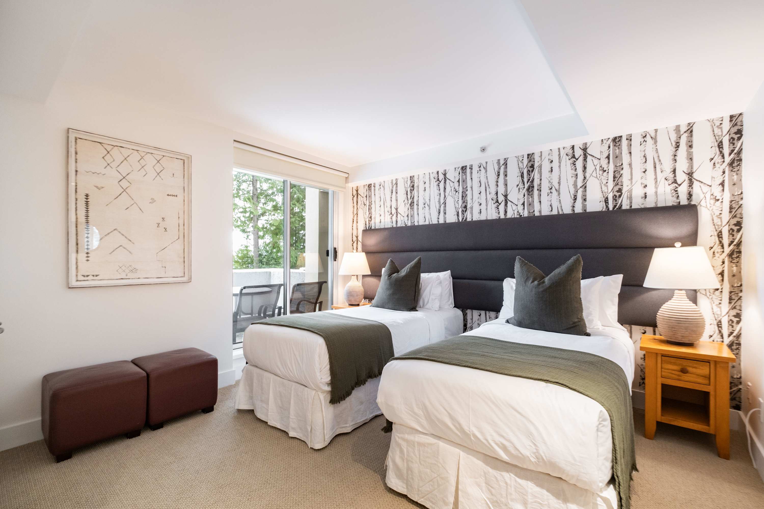 - Bedroom 2 – Two twin beds - Bright window views and cozy bedding for restful stays - Flexible setup perfect for families and peaceful nights inside with extra comfort