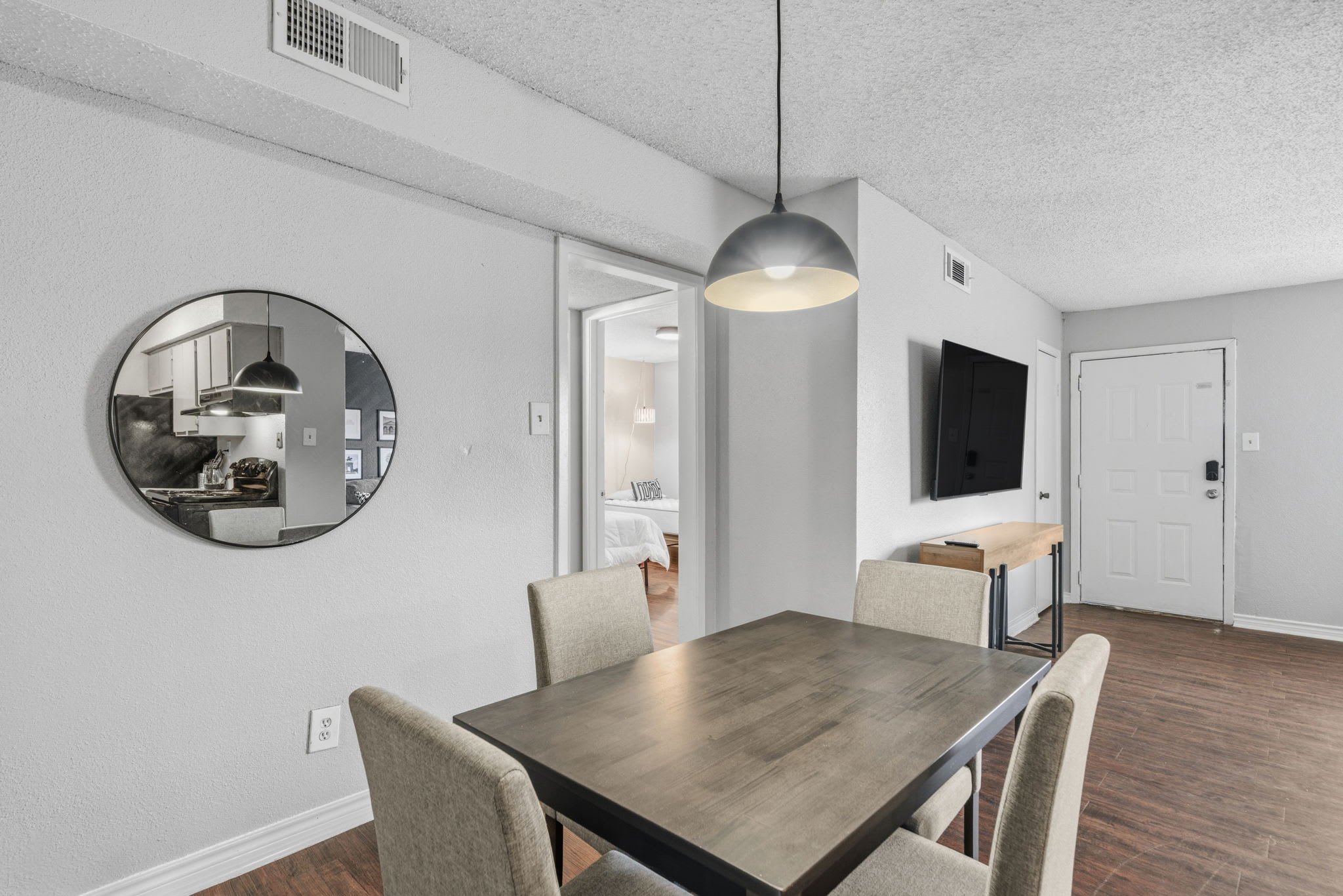 Modern dining area with stylish seating and a cozy ambiance, perfect for family meals or entertaining.