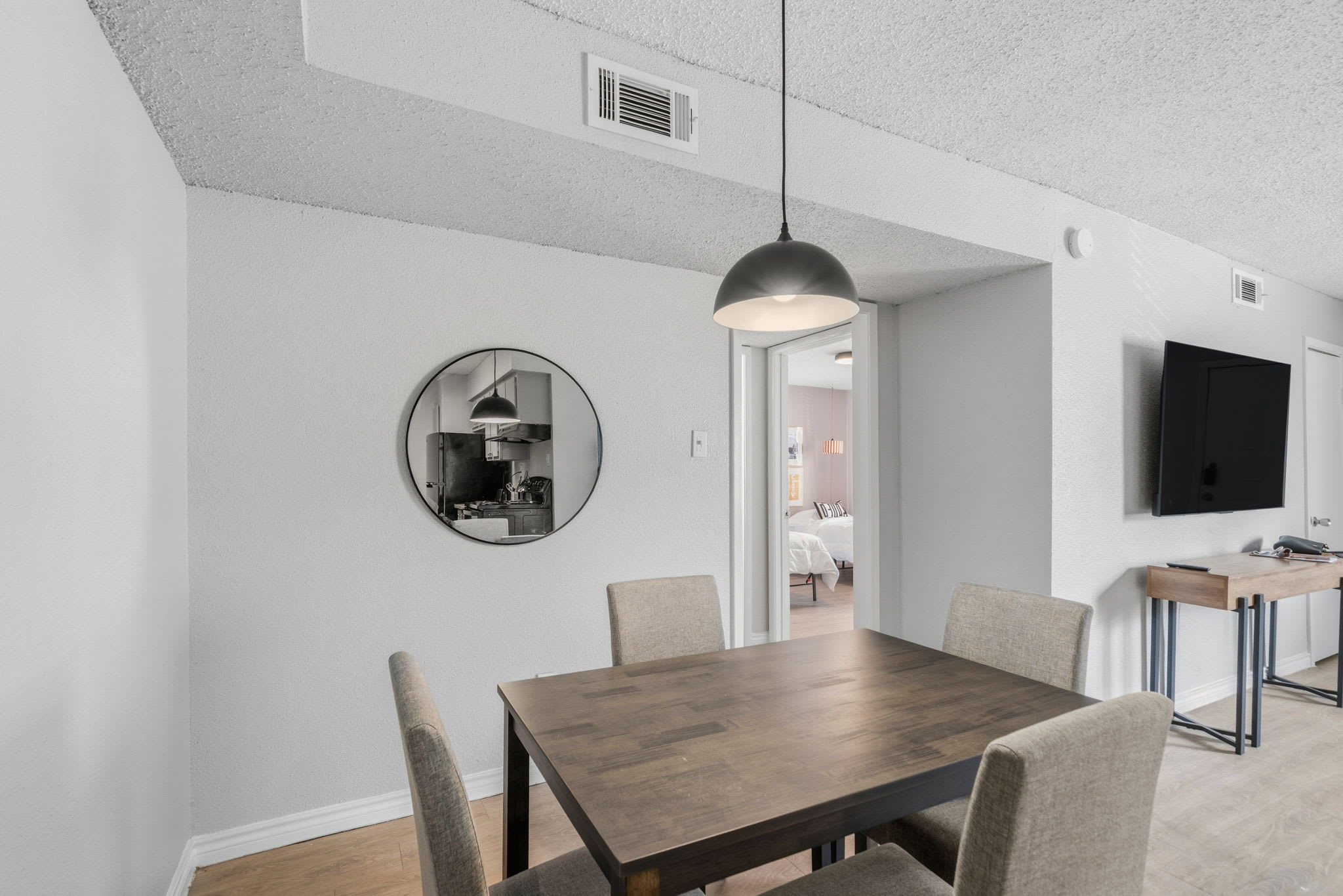 Chic dining area with modern furnishings and a cozy ambiance, perfect for family meals or entertaining guests.